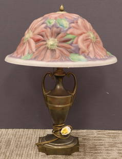 A collectores Pairpoint Puffy Lamp: The highly decorative reverse painted frosted glass shade features large chrysanthemums amongst serrated leaves all in beautiful rich hues. The whole rests on a partial plated, bronze finished twin ha