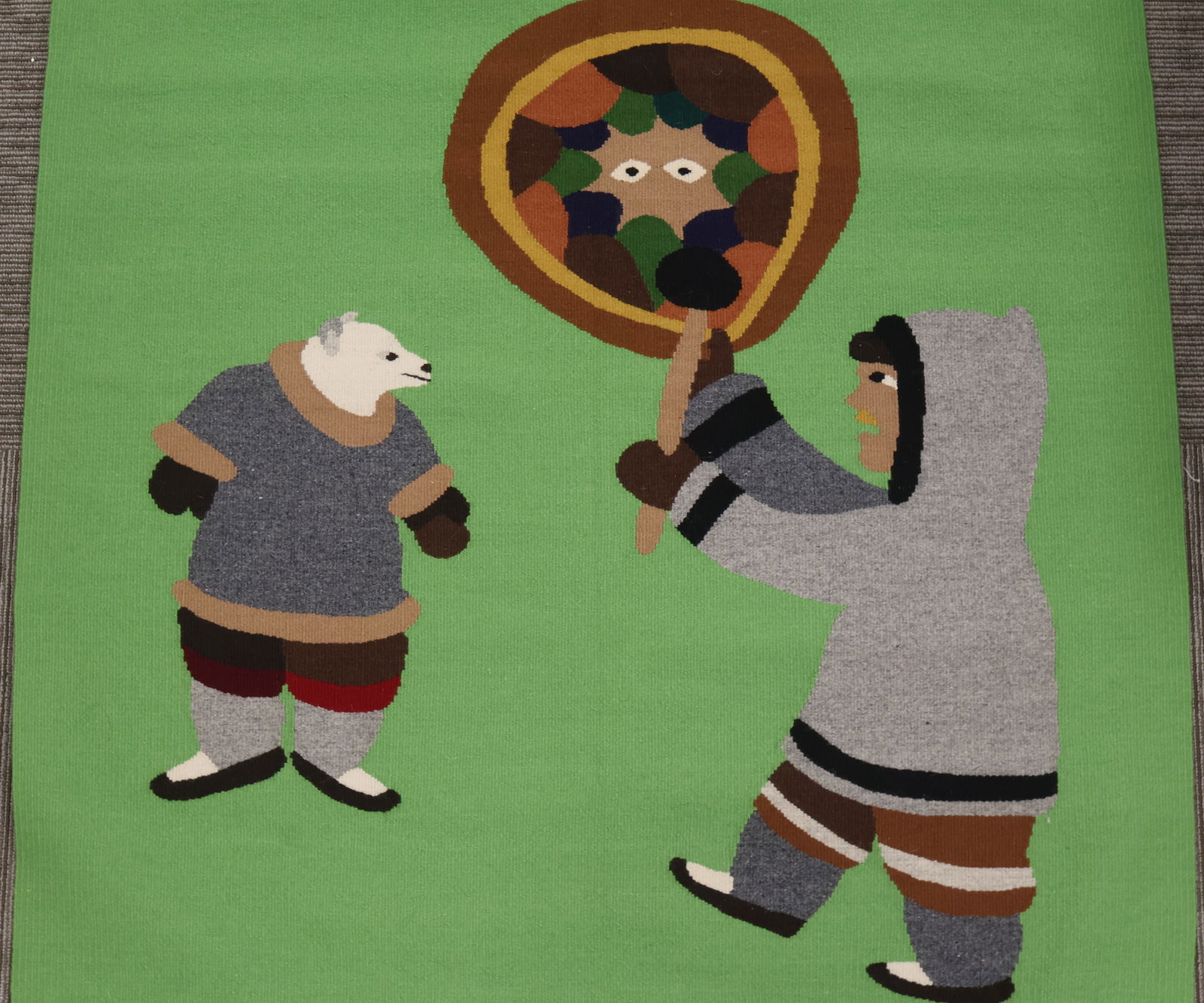 Malaya Akulukjuk, Pangnirtung (1915-1995) & Olassie Akulukjuk (b.1951): A wool weaving (textile / tapestry) titled “Drum Dancer #134”. Signed & titled in Roman and syllabics verso. Image size: 48”x42” unframed.