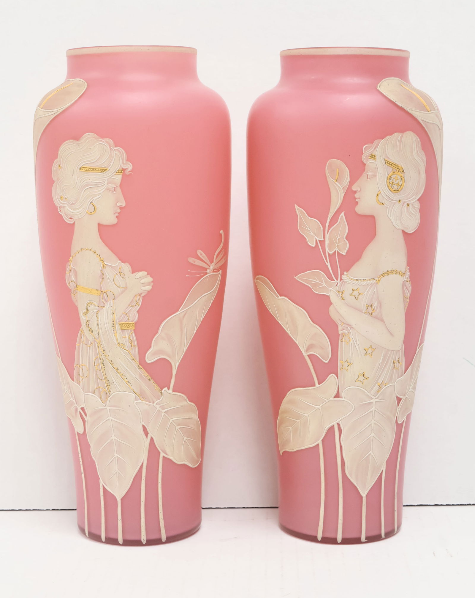 Pair of antique Art Nouveau cameo glass vases: The soft satin-glass pink ground features a Thomas Webb style raised motif showing the profile of period clad woman amongst leavy vines & flowers. The whole features gilded highlights overall. Height:
