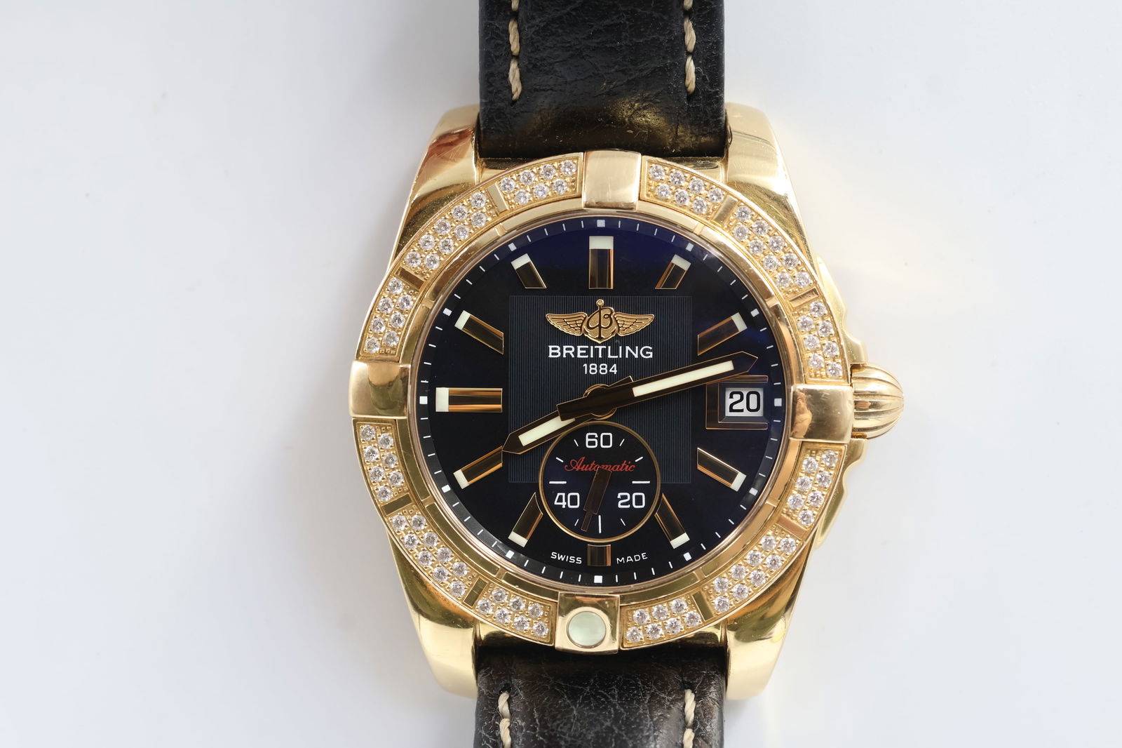 Breitling Galactic 36 Auto — Ref 1443513: Breitling Galactic 36 automatic watch, reference 1443513. 36mm stainless steel case. Factory diamond-set bezel. Gold dial with luminous markers. Black leather strap. Presented with original box and