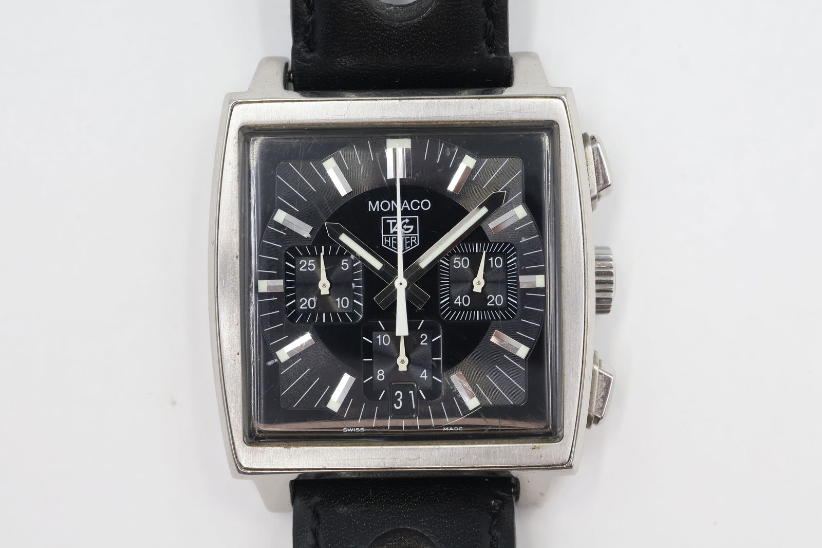 TAG Heuer Monaco Auto — Ref CW2111-0: TAG Heuer Monaco automatic, reference CW2111-0. Stainless steel case. Case size: 38 mm Black dial, silver hands, numeral markers. Sapphire crystal. Black leather strap with steel buckle (up to 8-inch