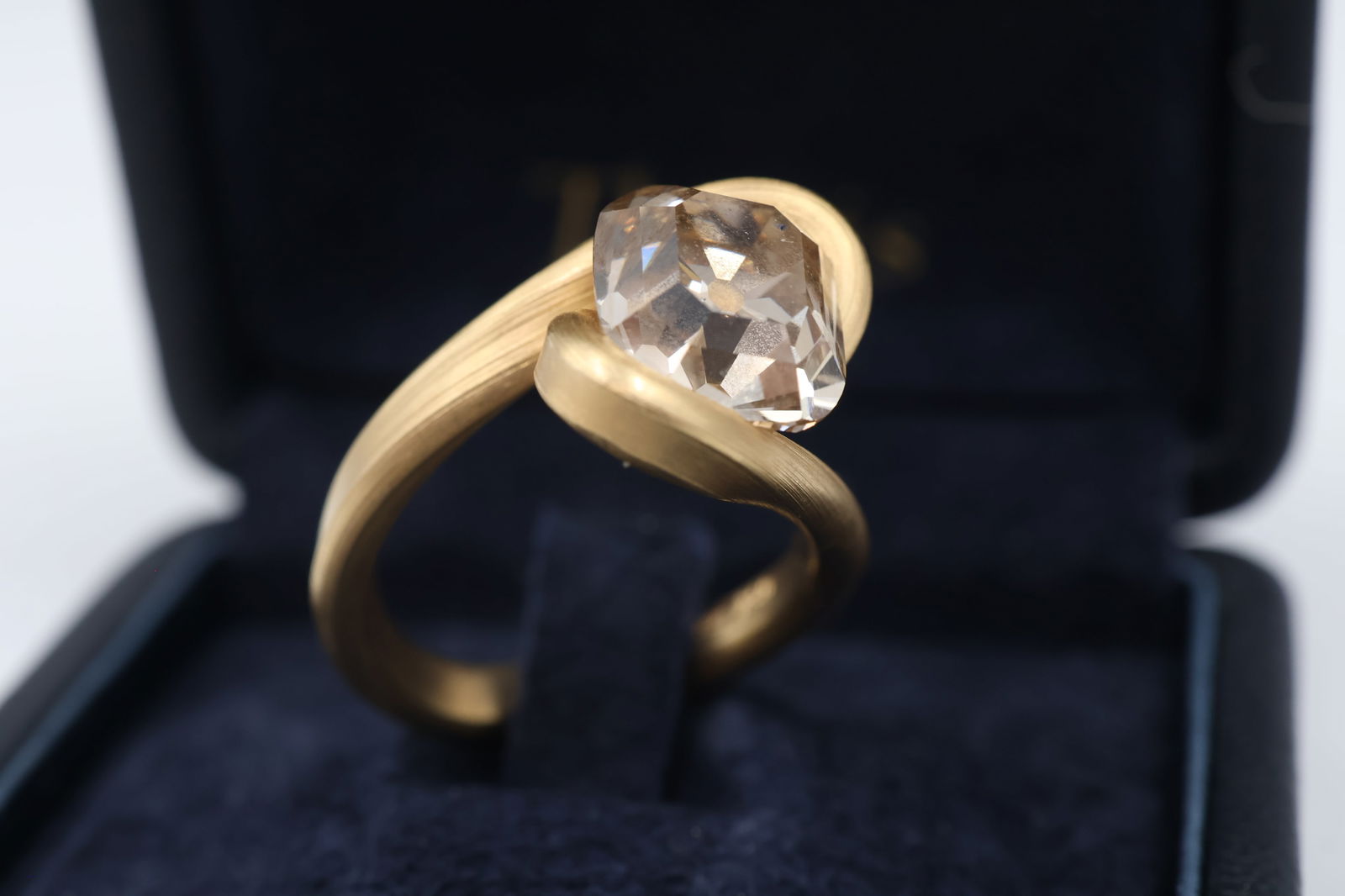 GIA 5.12ct Fancy Orangy Brown Diamond Ring: Ring set with a GIA-certified 5.12ct natural fancy orangy brown cushion step cut diamond in 18k gold. Total weight: 10.3g. GIA report #2213492816.