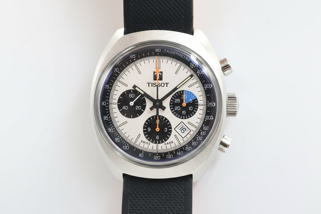 Tissot Heritage Auto Chrono — Ref T124427A: Tissot Heritage Automatic Chronograph, reference T124427A, circa 1973. 43mm stainless steel case. White dial, 12-hour indicator, date, chronograph. 27-jewel automatic movement. Exhibition caseback.