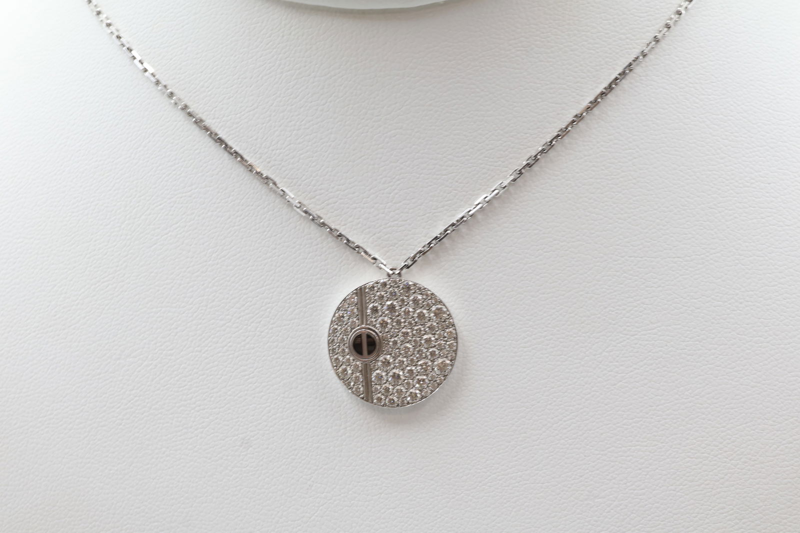 Cartier Love Diamond Pendant — 18k White Gold: Cartier Love collection circle pendant in 18k white gold, pavé-set with white diamonds, accented with black ceramic. 18-inch 18k white gold chain. Engraved: "Sam 26.08.08". Total weight: 9.6g.