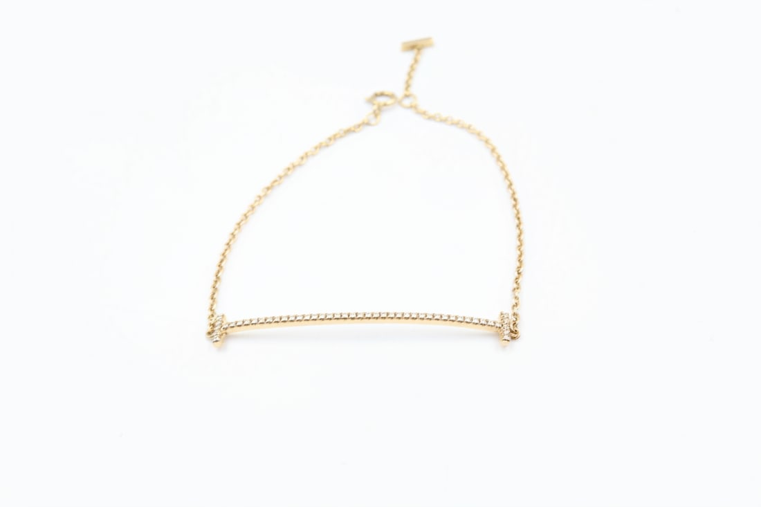 Tiffany & Co. 18k Gold Smile Bracelet: Tiffany & Co. Smile bracelet in 18k gold. Total weight: 2.3g. Stamped Tiffany & Co., 750.