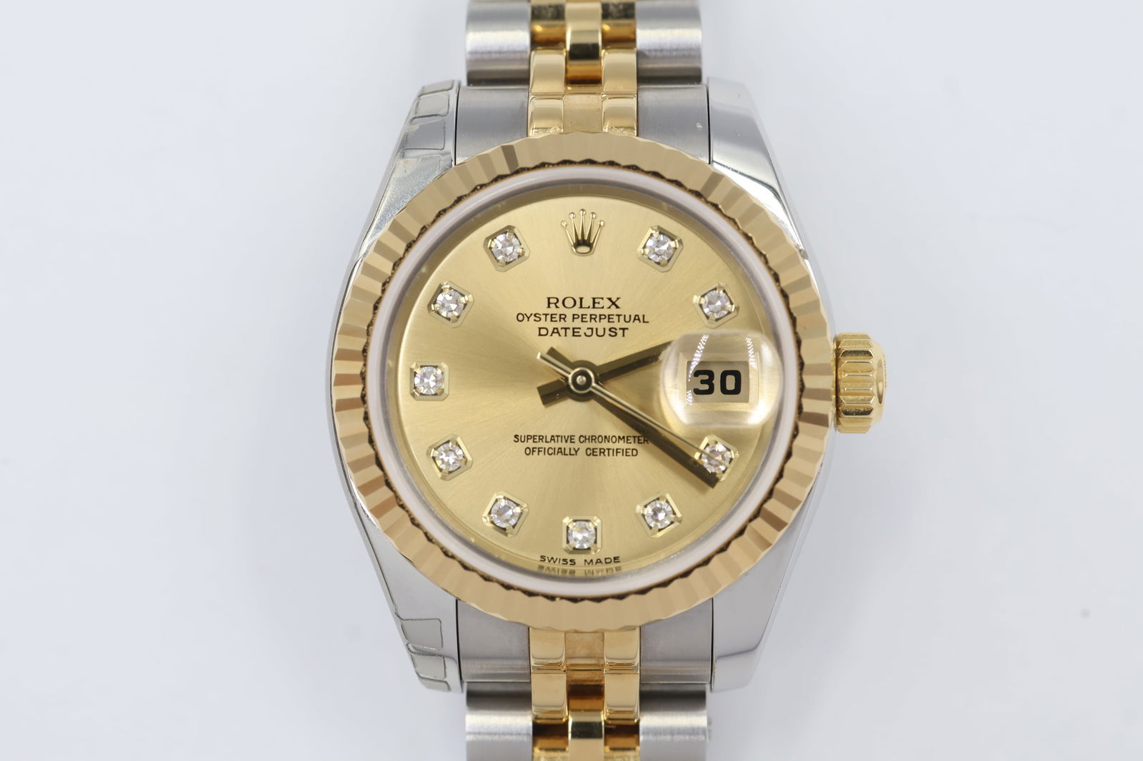 Rolex Ladies Two-Tone — Diamond Hour Markers: Rolex ladies' watch in two-tone stainless steel and yellow gold. Gold dial with diamond hour markers.