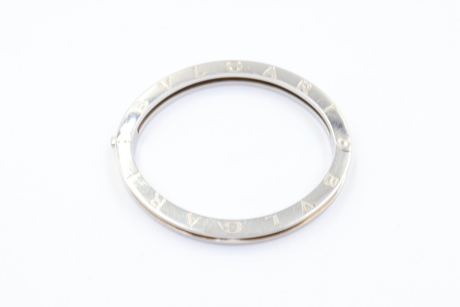 Bulgari B.Zero1 18k Gold & Steel Bracelet: Bulgari B.Zero1 bangle bracelet in 18k yellow gold and stainless steel. Central band of gold. Fits 6.5-inch wrist. Total weight: 30g. Stamped Bulgari, 750.