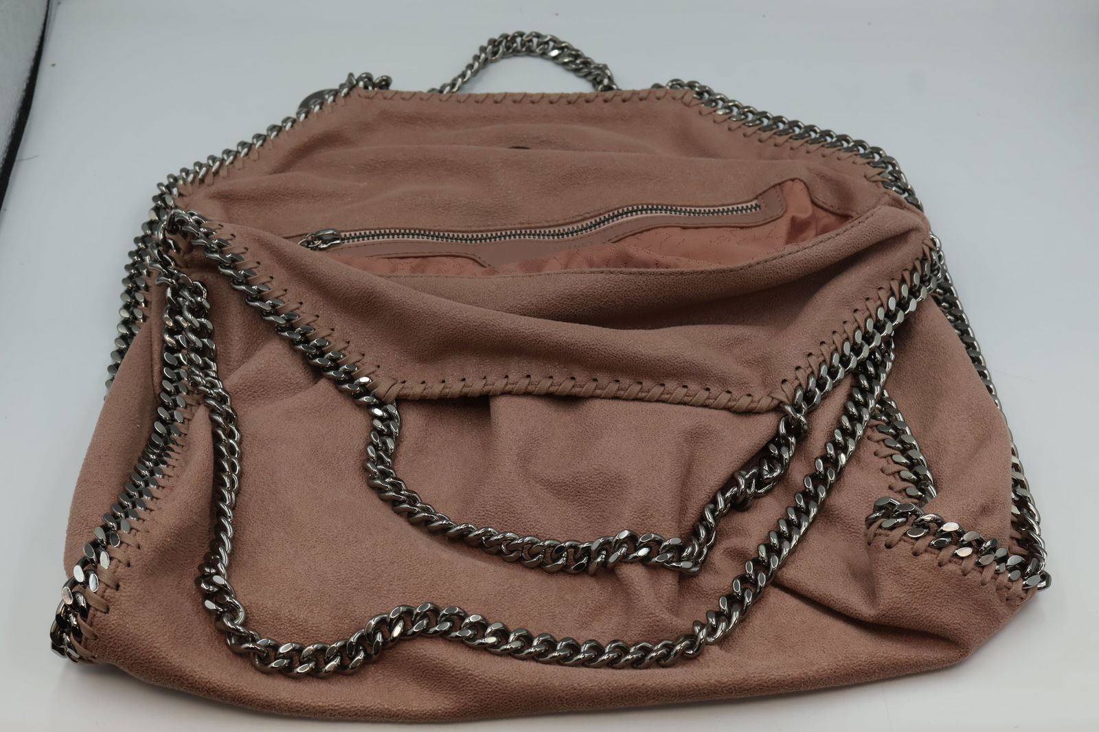 Stella McCartney Falabella Faux Suede Tote: Stella McCartney Falabella fold-over faux suede tote in pink. Dimensions: 16" L × 16" H × 5" D. Silver toned hardware. In very good condition.