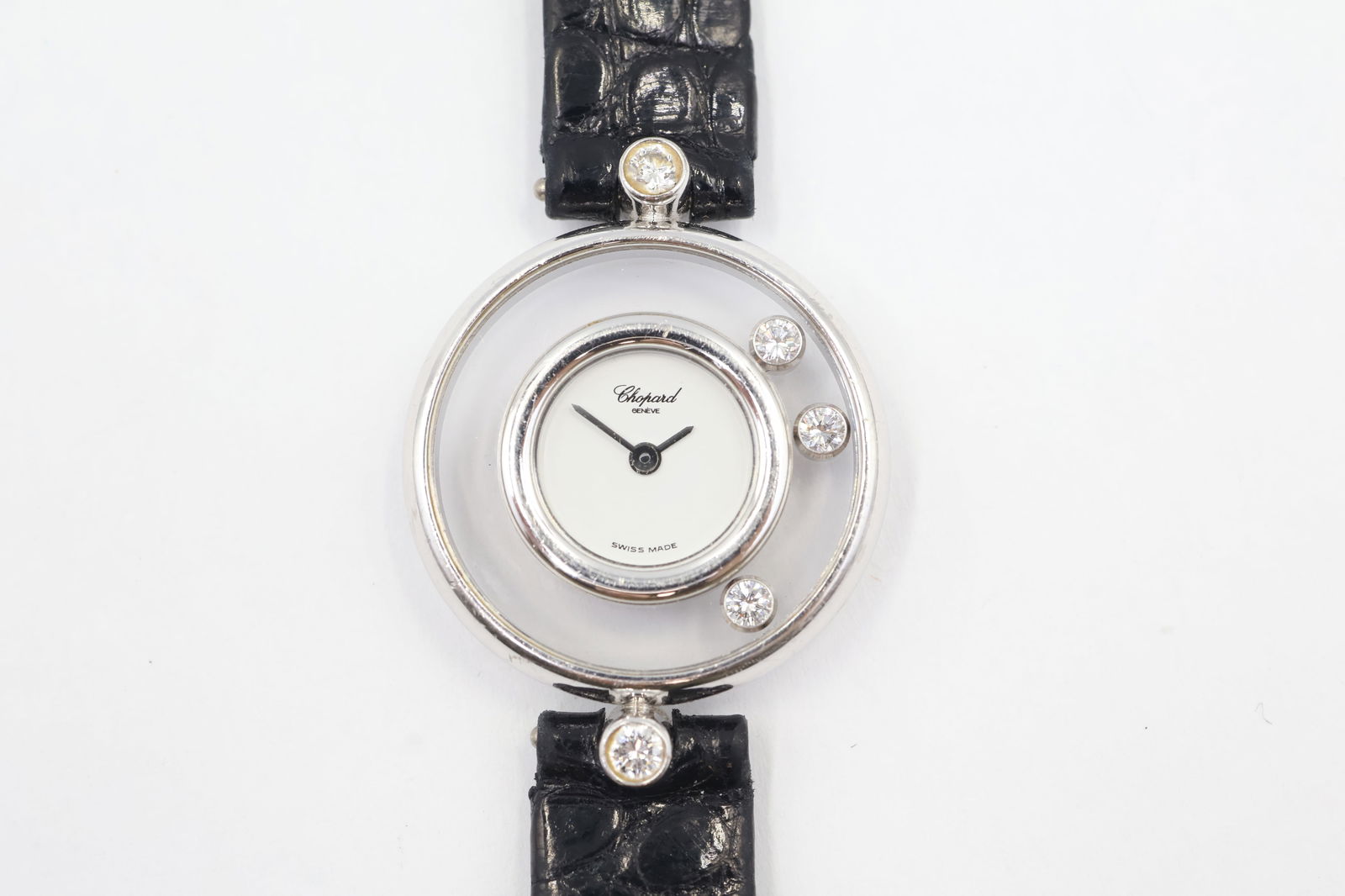 Chopard Happy Diamonds Watch — 22mm, Box: Chopard Happy Diamonds ladies' quartz watch. 22mm round stainless steel case with diamond bezel. White dial. Black leather strap. Sapphire crystal. Presented with original box.