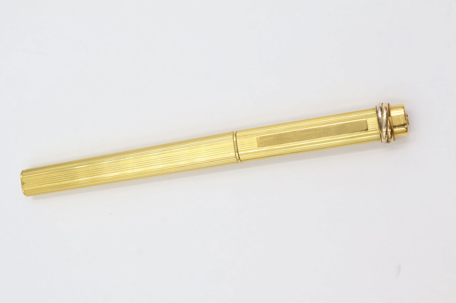 Cartier Gold-Plated Ballpoint Pen: Cartier ballpoint pen in gold-plated finish. Stamped Cartier.