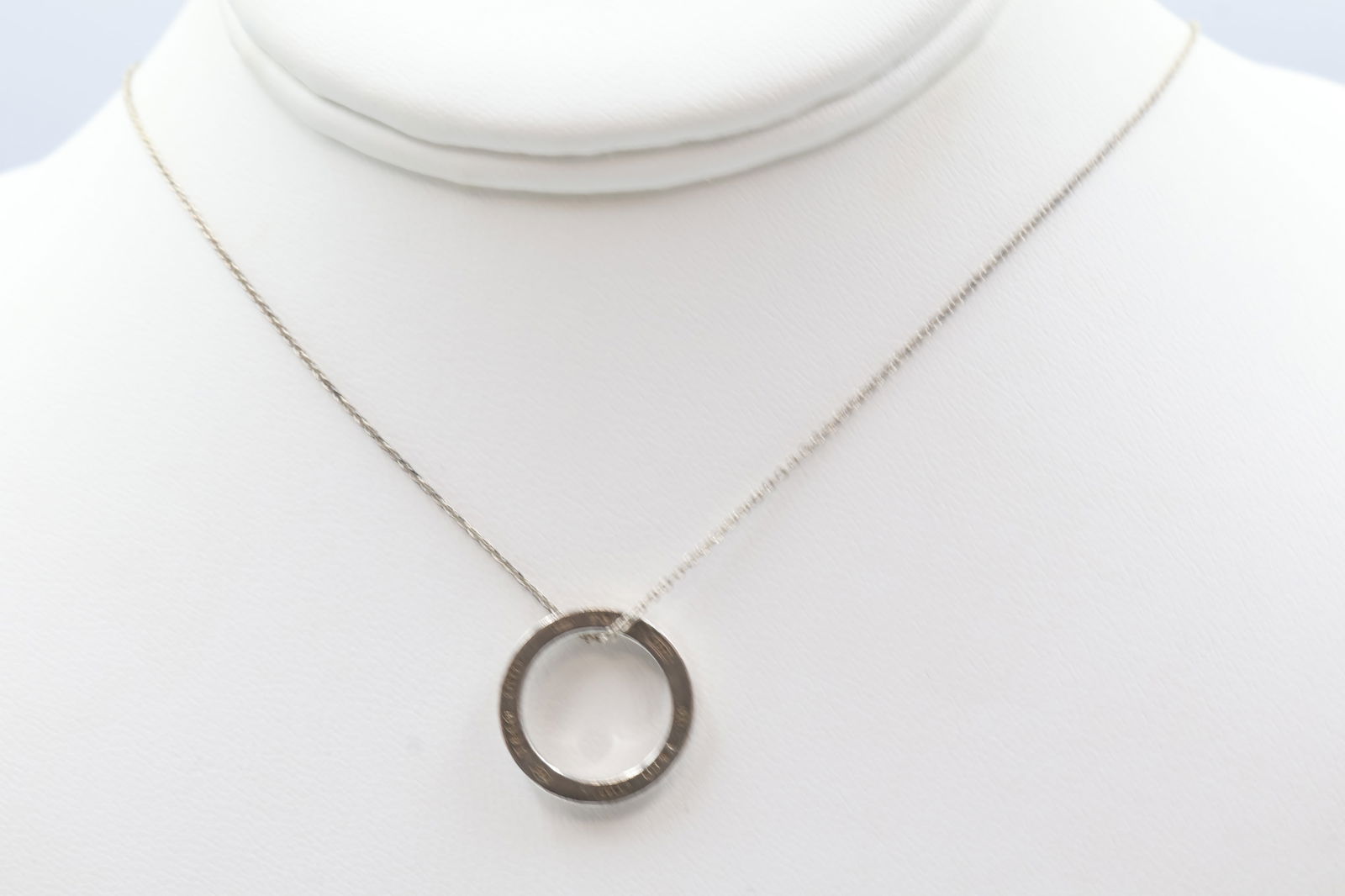 Tiffany & Co. 925 Silver Circle Charm Necklace: Tiffany & Co. circle charm necklace in 925 sterling silver. Length: 14 inches. Total weight: 3.8g. Stamped Tiffany & Co., 925.