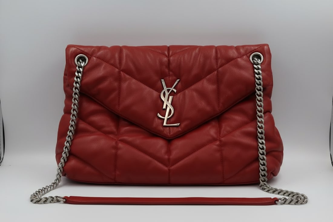 YSL Red Leather Lula Puffer Flap Bag 2019: Saint Laurent Lula puffer flap handbag in red nappa leather with silver toned hardware, 2019. Dimensions: 13.7" L × 9" H × 5.3" W. Serial number on interior label.