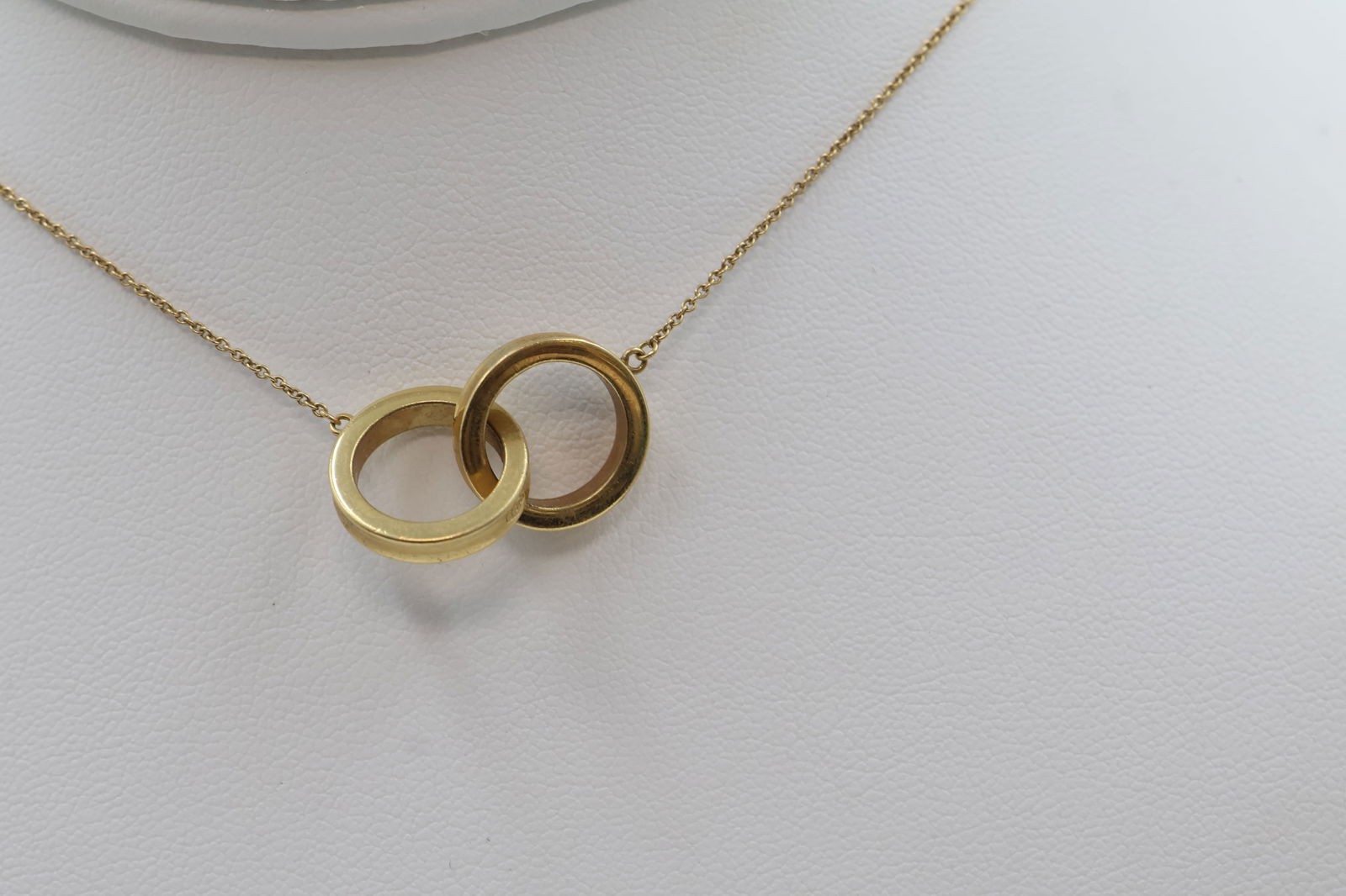 Tiffany 18k Gold Double Circle Pendant Necklace: Tiffany & Co. double circle pendant necklace in 18k gold. Total weight: 7.4g. Stamped Tiffany & Co., 750.