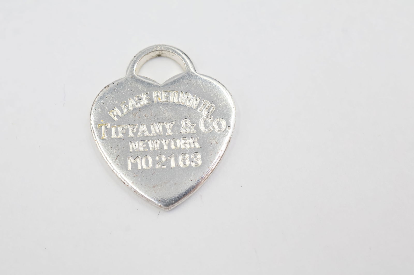 Tiffany & Co. Heart 925 Charm: Tiffany & Co. heart charm. Total weight: 4.83g. Stamped Tiffany & Co. Crafted of 925 sterling silver.