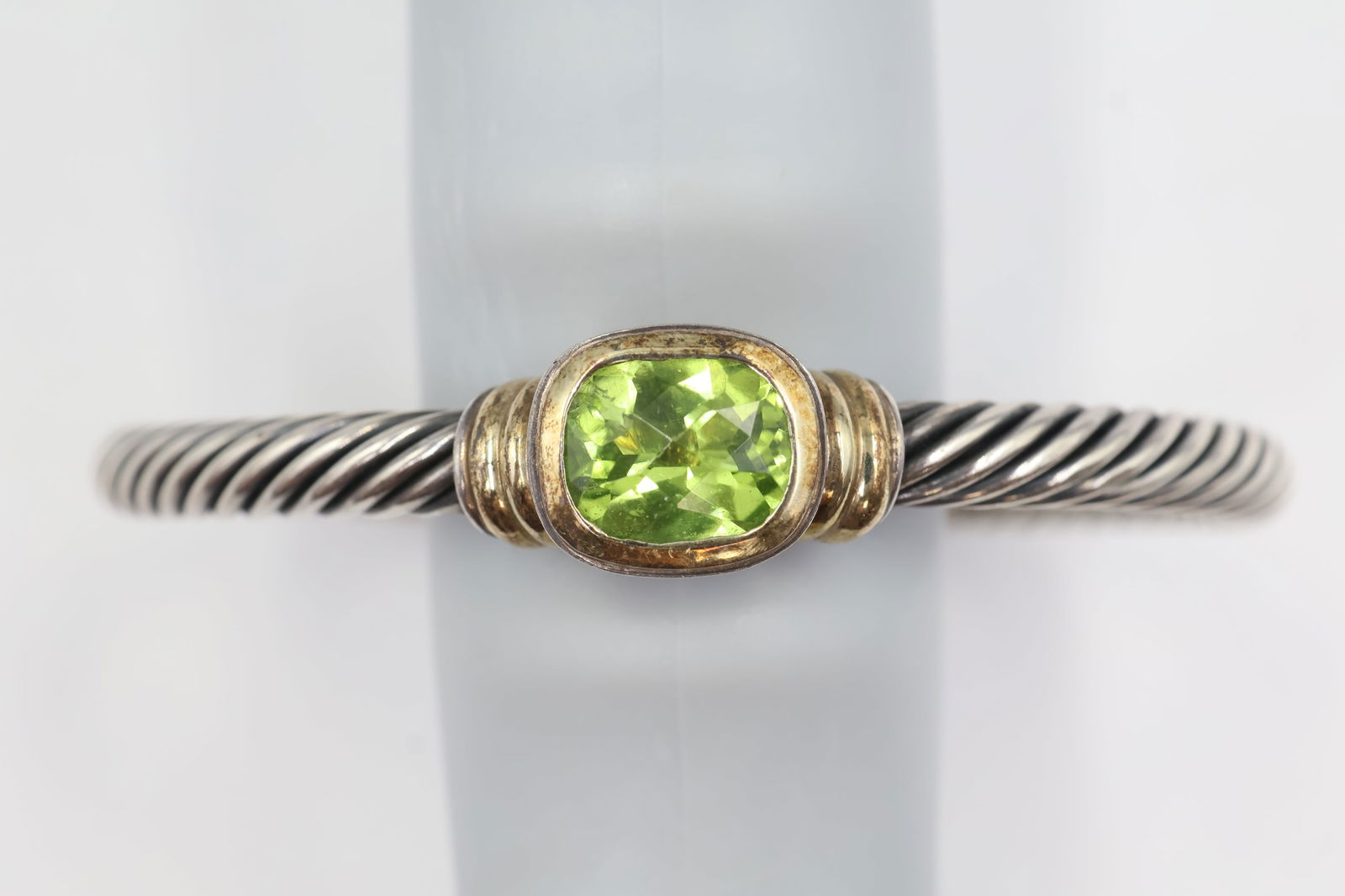 David Yurman Cable Cuff — Green Stones 32.3g: David Yurman cable cuff bracelet in 925 sterling silver set with 2 green-toned stones. Total weight: 32.3g. Stamped David Yurman, 925.