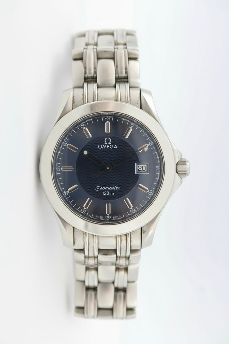 Omega Seamaster Quartz — Blue Wave Dial 40mm: Omega Seamaster quartz watch, 40mm case, with iconic blue wave dial.