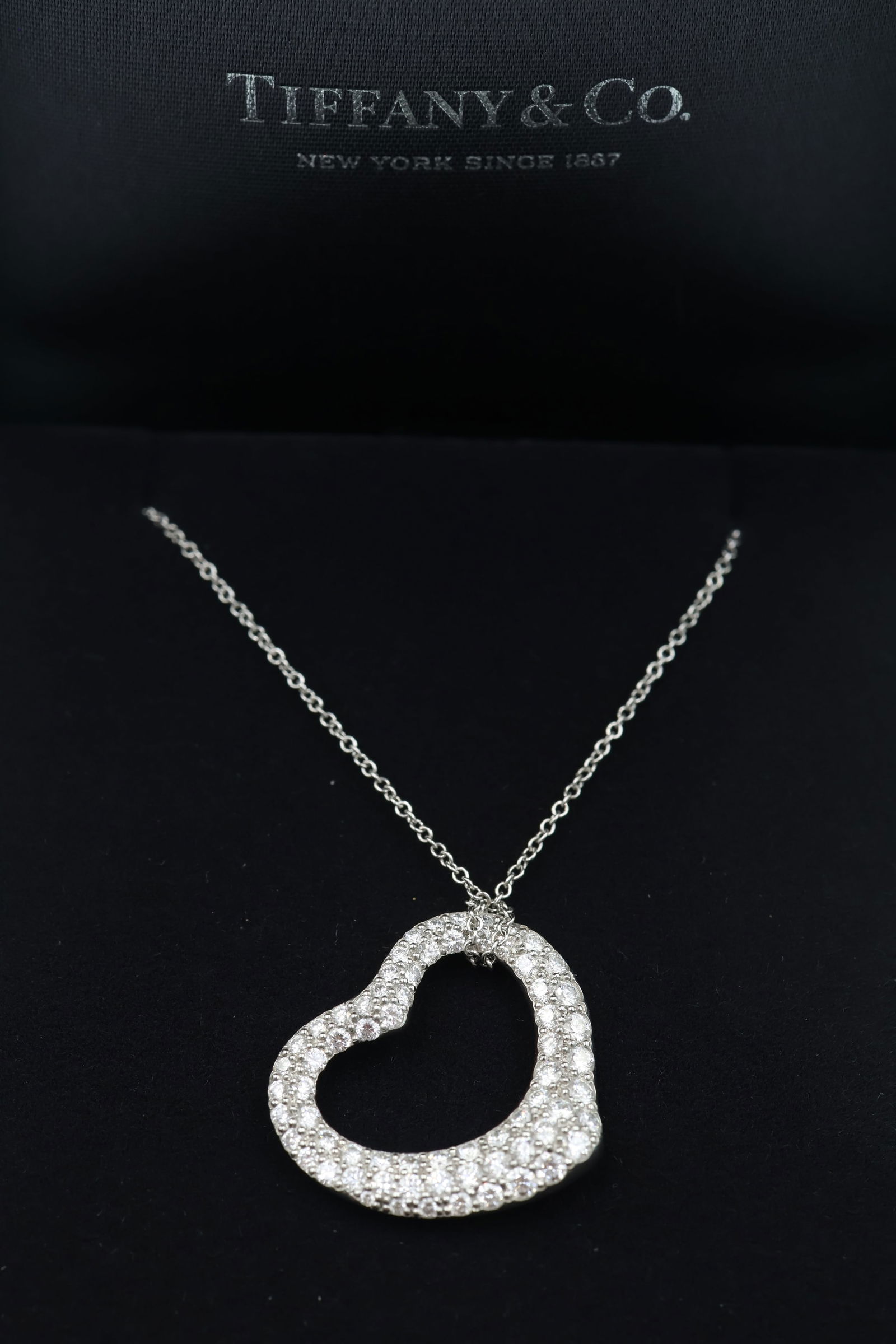 Tiffany 18k Gold Diamond Heart Pendant — Box: Tiffany & Co. heart pendant in 18k gold set with diamonds. Presented in original Tiffany & Co. box. Stamped Tiffany & Co., 750.