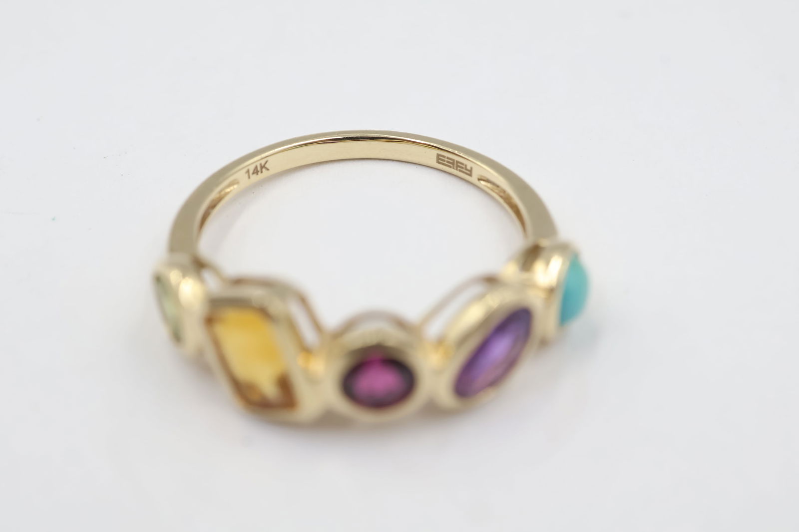 Unique 14K Gold Asymmetric Ring w/ 5 Gemstones: 14k asymmetrical stone set ring featuring five vibrant gemstones: turquoise, peridot, amethyst, citrine, and sapphire. This unique, artful design highlights each stone’s natural color while