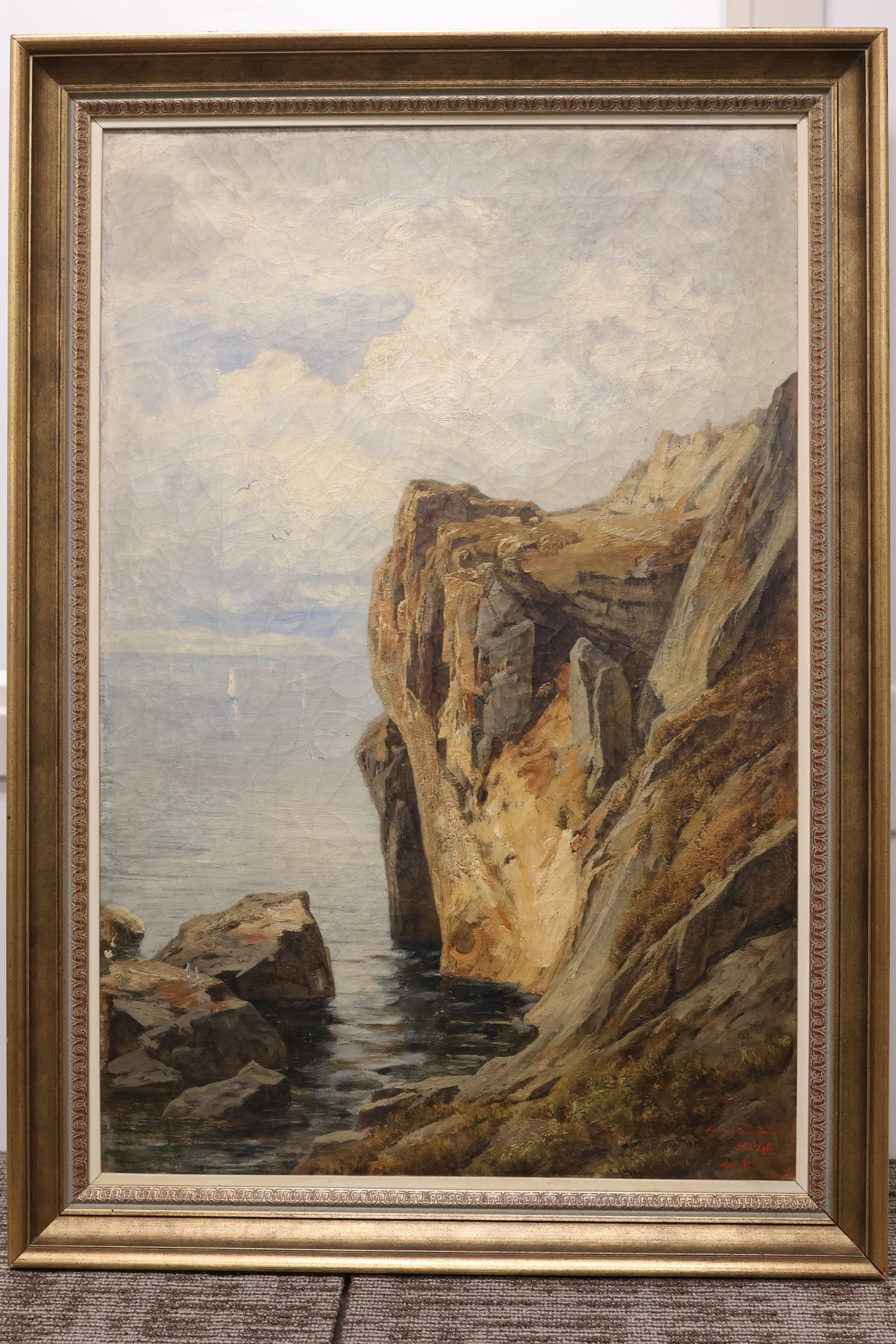 Alfred Zoff, Austrian (1852-1927): Oil on canvas showing a coastal scene with dramatic cliffs. Signed & dated May 1884 l/r with personal dedication from the artist. Image size: 29.5 x 20 inches (Frame size: 34 x 24 inches).