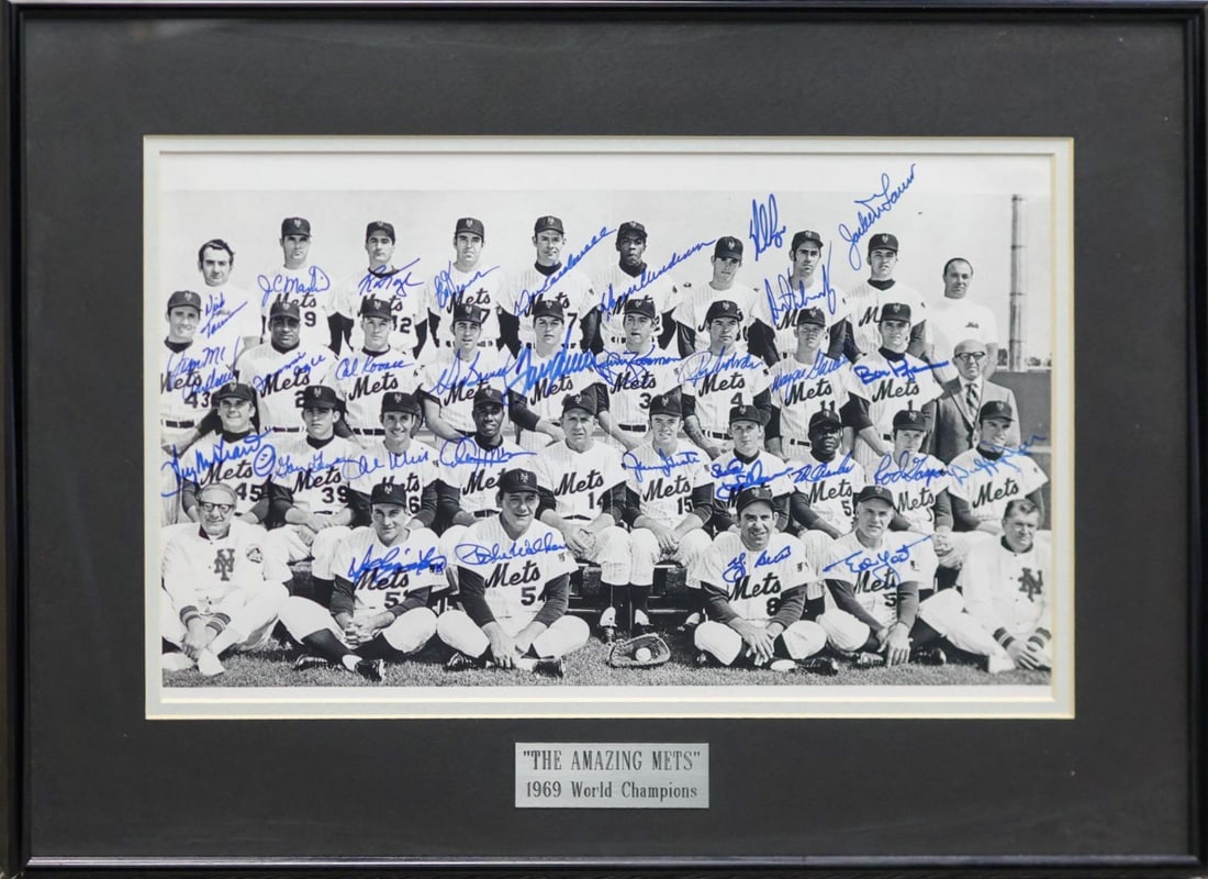 1969 'Amazing Mets' World Series Champions Multi-Signed Team Photo Display - Seaver, Ryan, Berra: 1969 'Amazing Mets' World Series Champions Multi-Signed Team Photo Display Featuring Tom Seaver, Nolan Ryan, Yogi Berra & More - JSA LOA (Greenshields Collection) Framed black-and-white team photograp