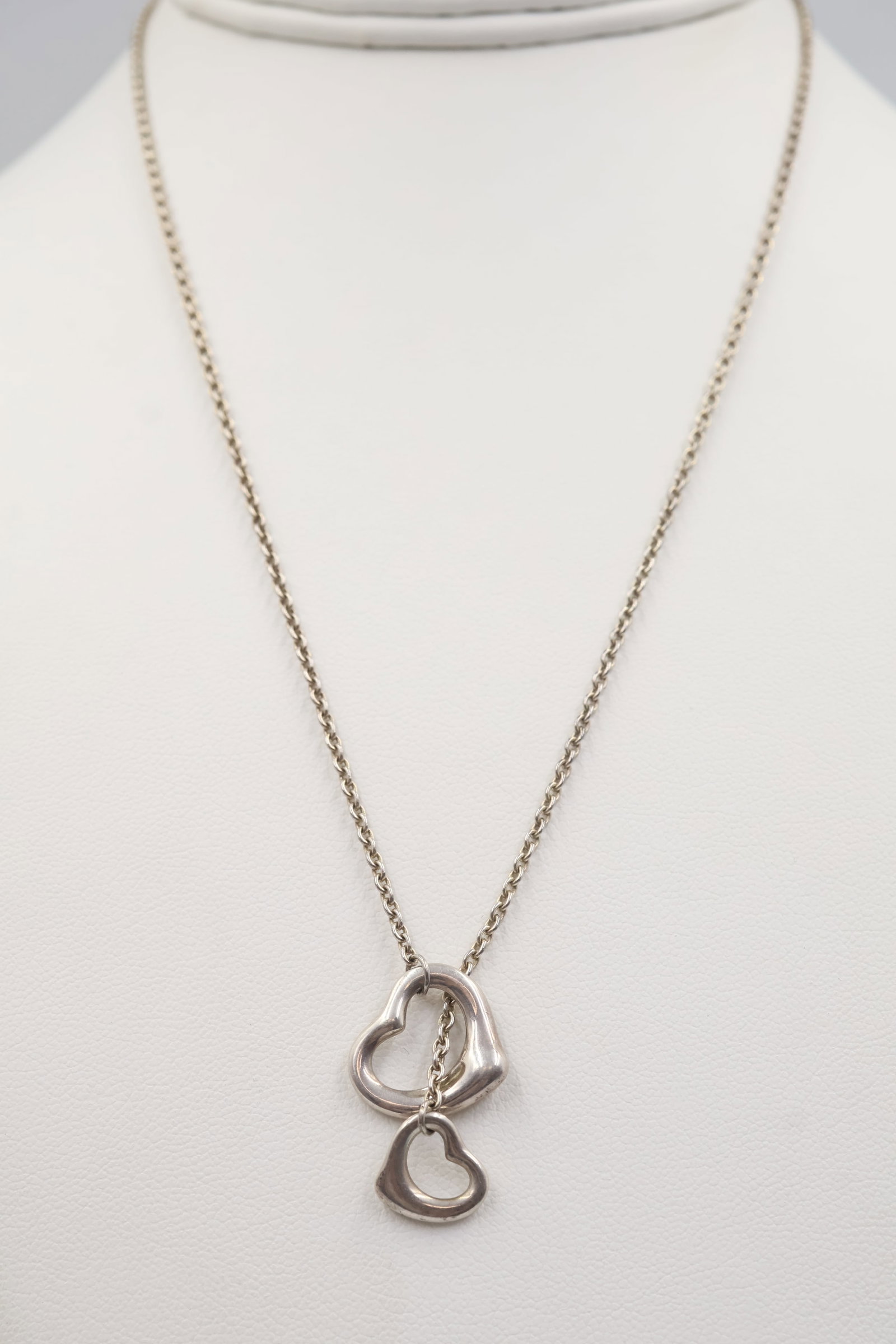 Elsa Peretti for Tiffany & Co Sterling Silver Open Heart Lariat: Tiffany & Co. lariat necklace featuring Elsa Peretti’s iconic Open Heart design. Measures approximately 20 inches. Total weight: 7 grams. Accompanied by a Tiffany & Co. pouch.