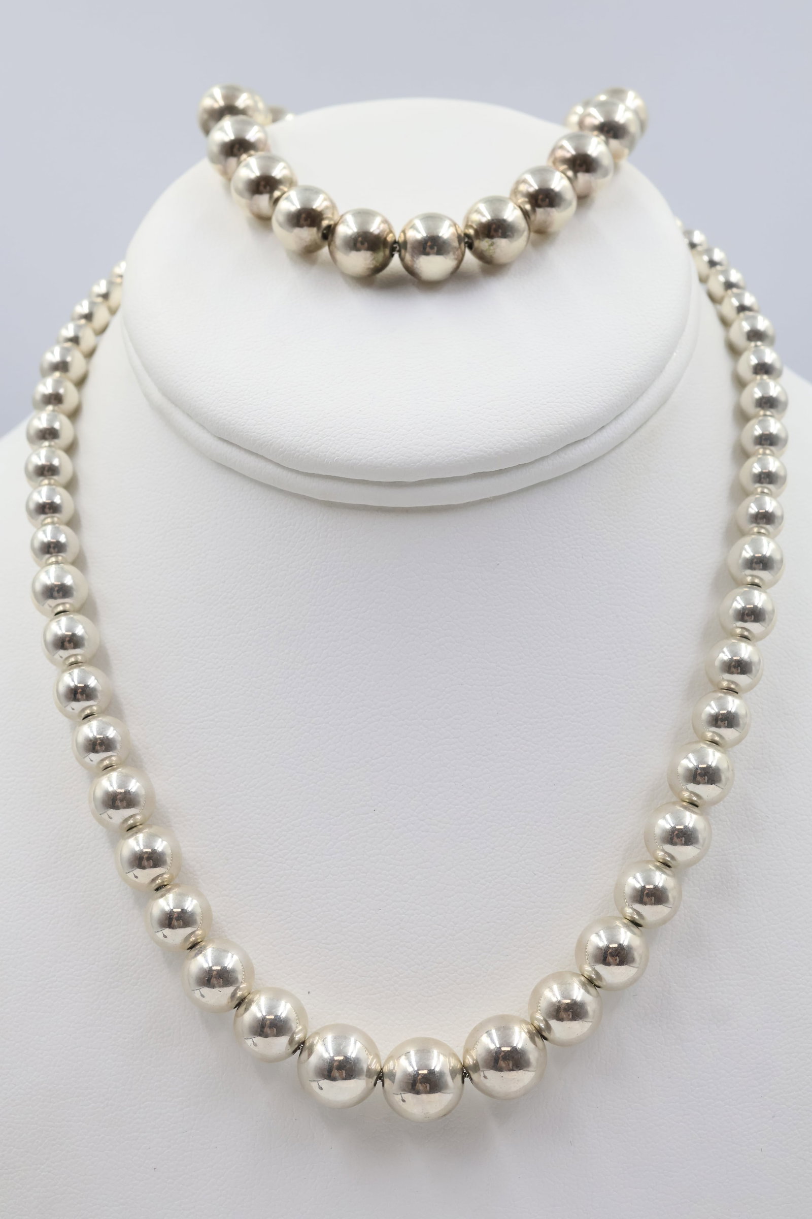 Tiffany & co 925 Ball Bead Necklace & Bracelet: Tiffany & Co. set comprising a sterling silver ball bead necklace and coordinating bracelet. A timeless and versatile pairing showcasing the House’s signature understated elegance. Weight 51.41 gram