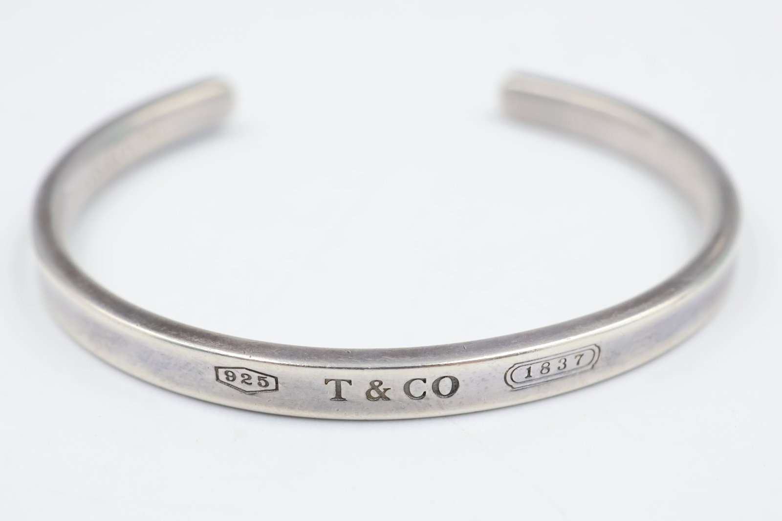 Tiffany & Co T & Co 925 Cuff: Tiffany & Co. cuff bracelet crafted in sterling silver. A sleek and timeless design showcasing the House’s signature understated elegance and enduring appeal. Weight 18.33 grams.