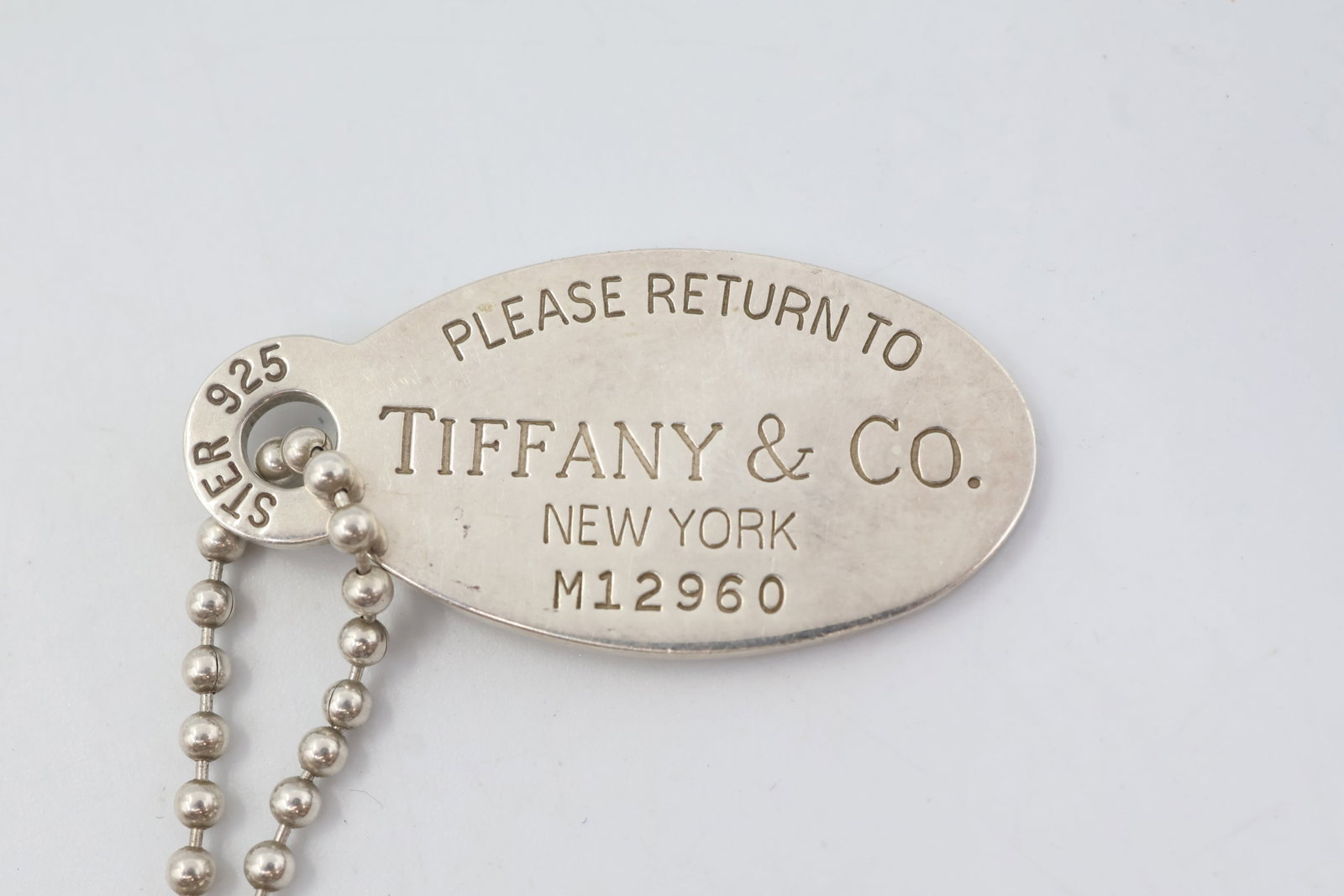 Tiffany & Co 925 Oval Dog Tag Pendant: Classic Tiffany & Co. oval dog tag pendant crafted in sterling silver. A sleek and timeless design showcasing the House’s signature understated elegance. Weight 25.54 grams.