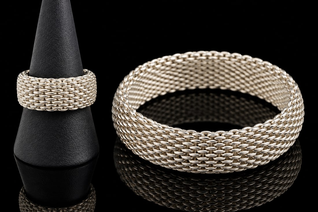Tiffany & Co 925 Mesh Bracelet & Ring: Tiffany & Co. set comprising a sterling silver mesh bracelet and coordinating ring. A sophisticated pairing showcasing the House’s timeless design and understated elegance. Weight 67 grams.