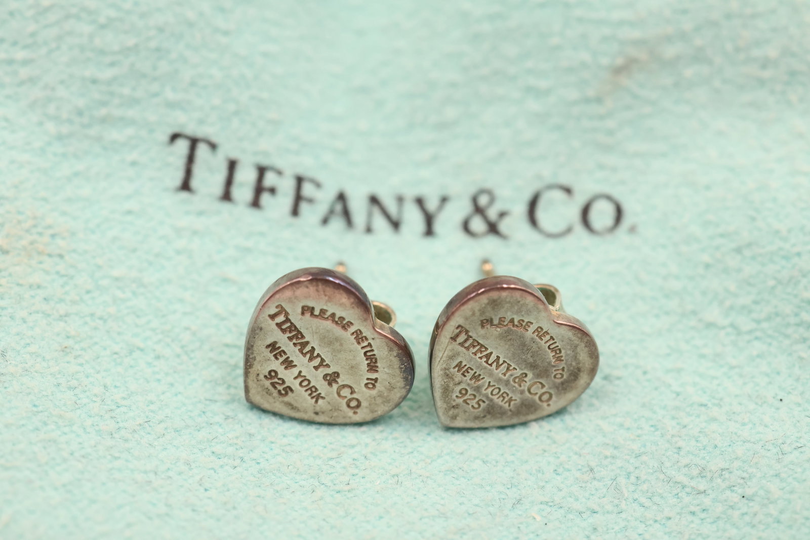 Tiffany & Co 925 Heart Tag Stud earrings: Tiffany & Co. stud earrings featuring the iconic heart tag design. Total weight: 2.1 grams.