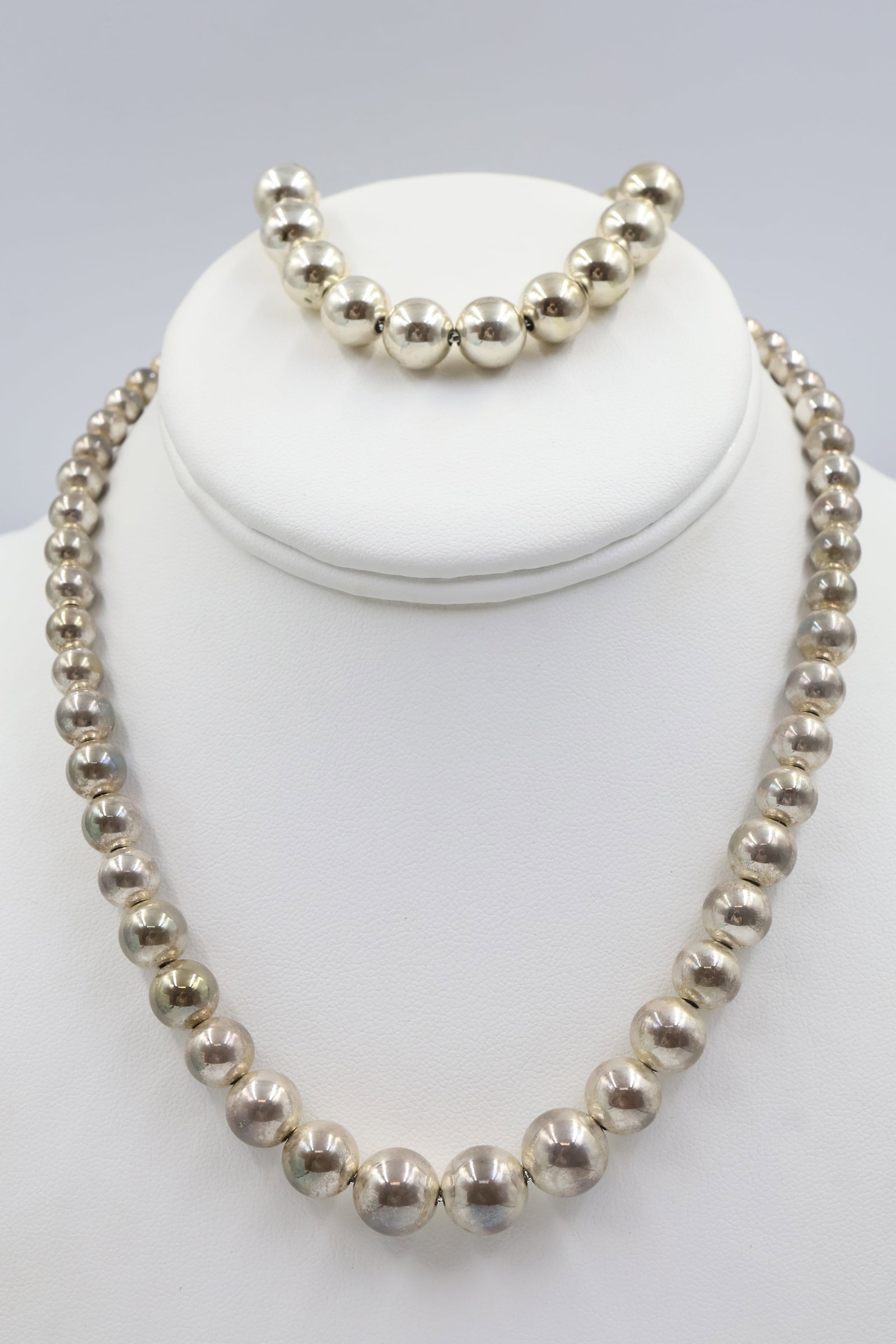 Tiffany & Co 925 Ball Bead Necklace & Bracelet: Tiffany & Co. 925 sterling silver ball bead set, comprising a 14-inch necklace and 6.5-inch bracelet. Combined weight: 47.2 grams. Accompanied by a Tiffany & Co. pouch.