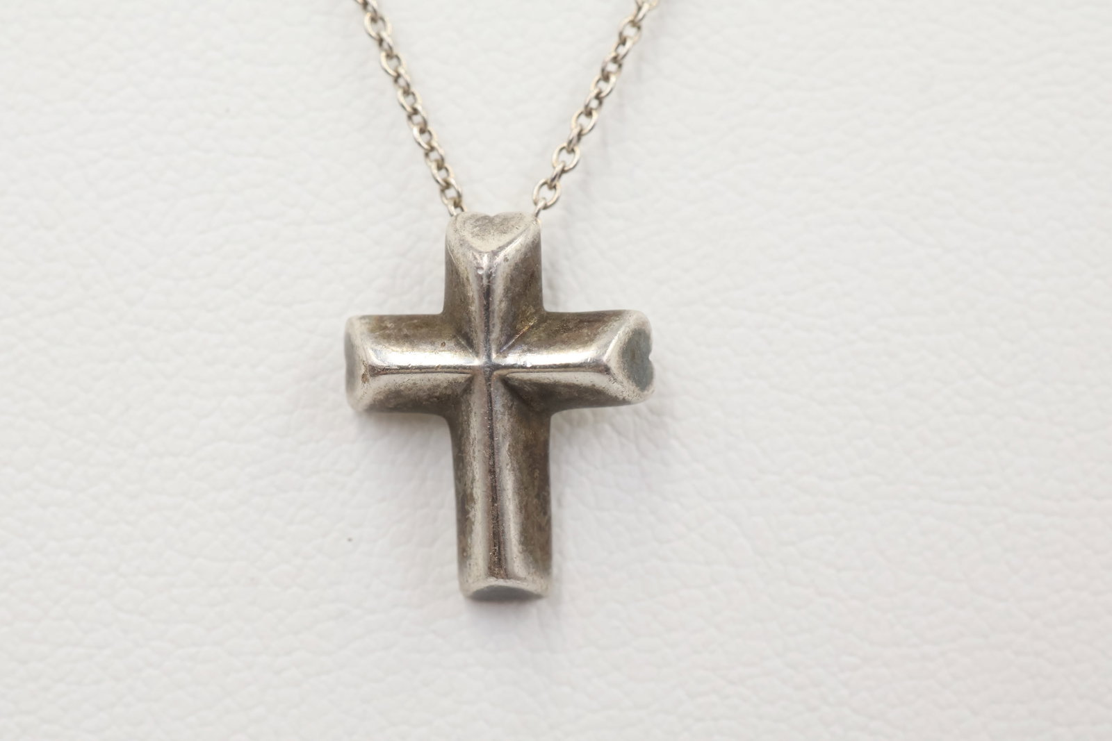 Paloma Picasso For Tiffany & Co 925 Cross Necklace: Tiffany & Co. necklace featuring Paloma Picasso’s classic cross design on a 16-inch chain. Total weight: 3.5 grams.
