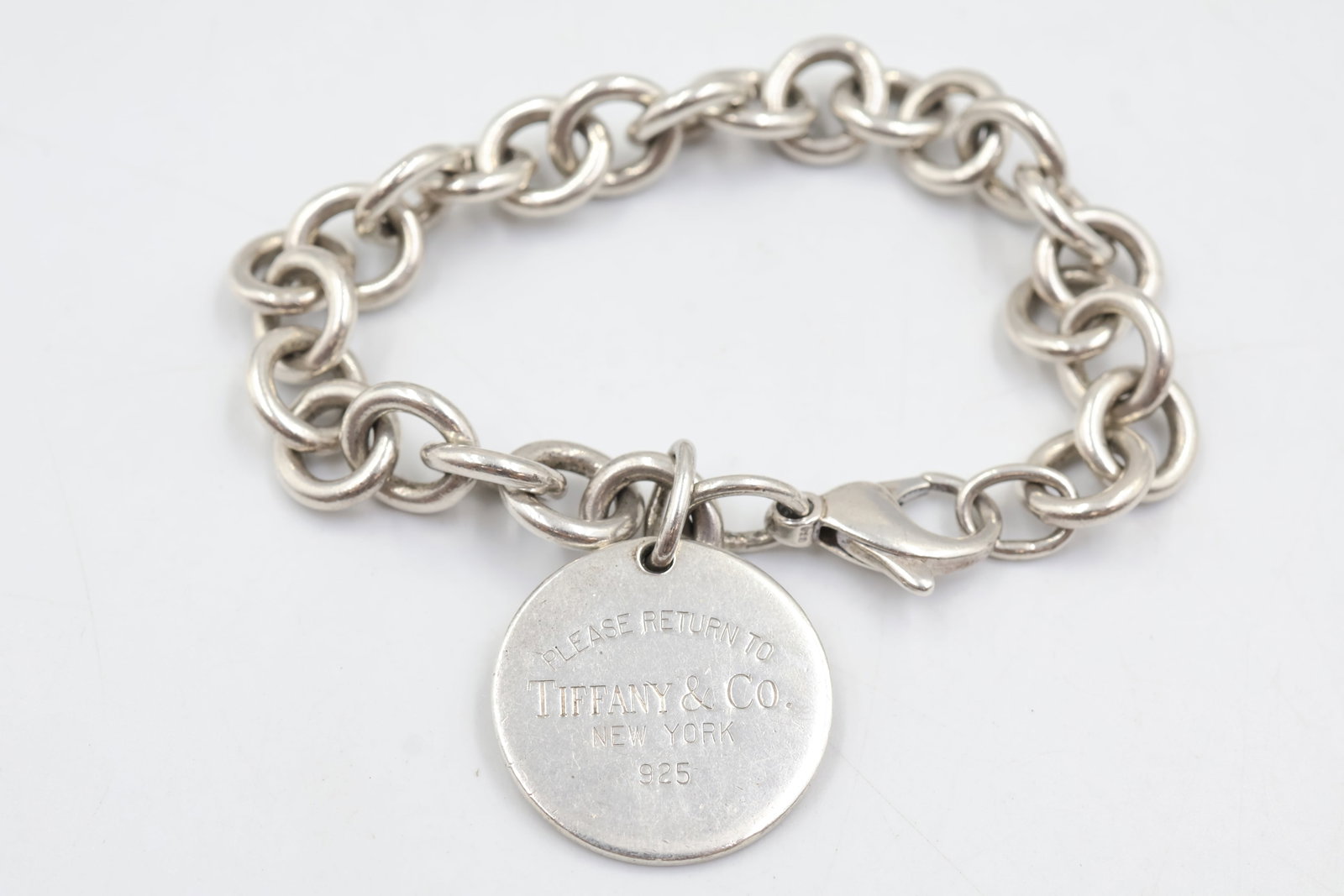 Tiffany & Co 925 return to Tiffany bracelet: Tiffany & Co. Return to Tiffany™ bracelet crafted in sterling silver. A timeless and instantly recognizable design from one of Tiffany’s most celebrated collections. Weight 35.88 grams.