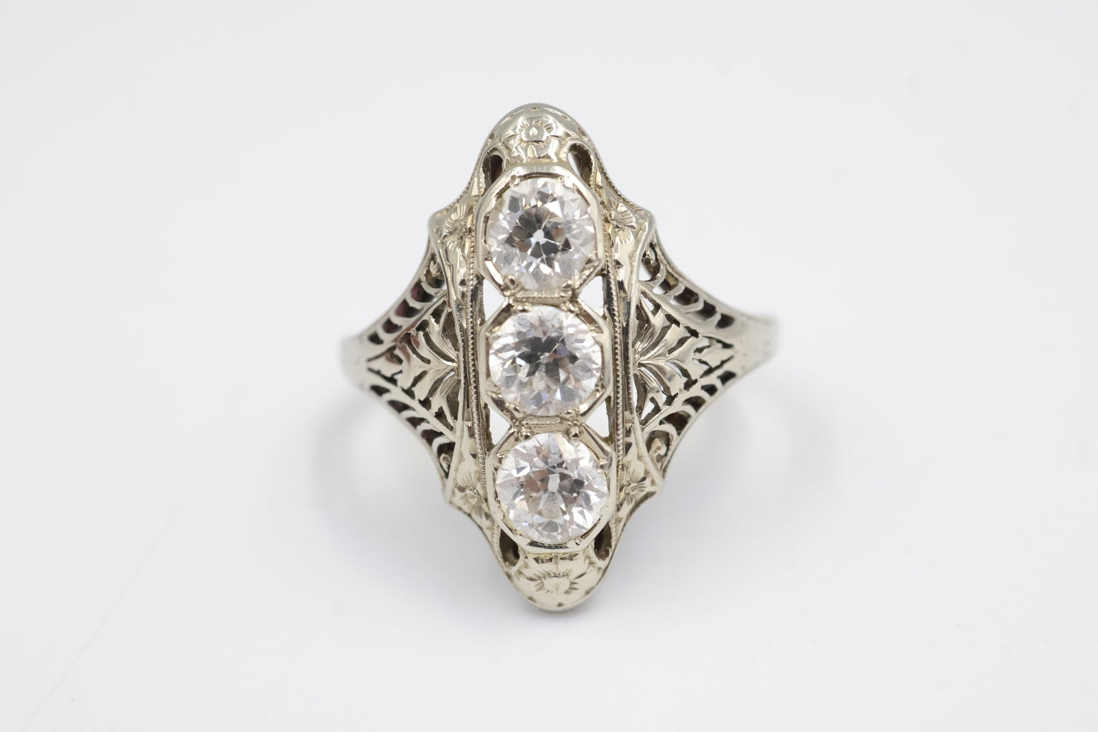 18k White Gold, Platinum & Diamond Ring: Ring crafted in 18K gold and platinum, set with three round European-cut diamonds 1.03 ct total Clarity VS, colour D-F. A timeless design showcasing classic brilliance and refined craftsmanship.