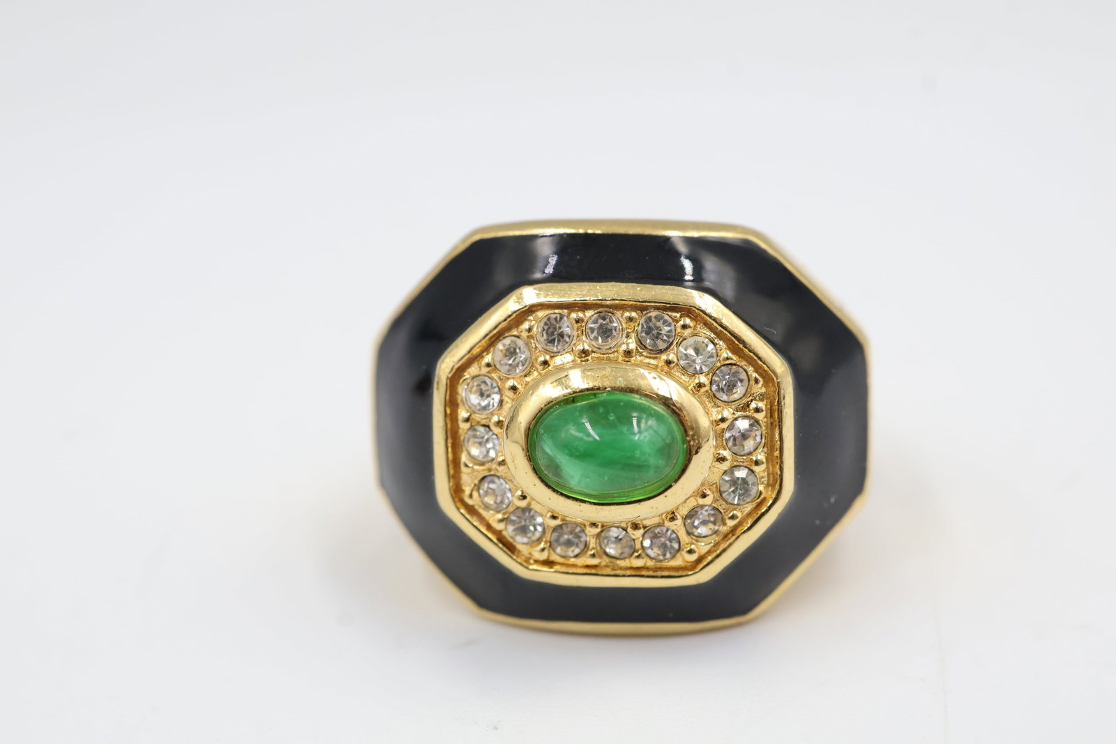 Dior Black Ename & Green Crystal Ring: Dior ring featuring black enamel, gold-tone detailing and sparkling crystal accents. A bold statement piece showcasing the House’s distinctive Parisian style and glamour.