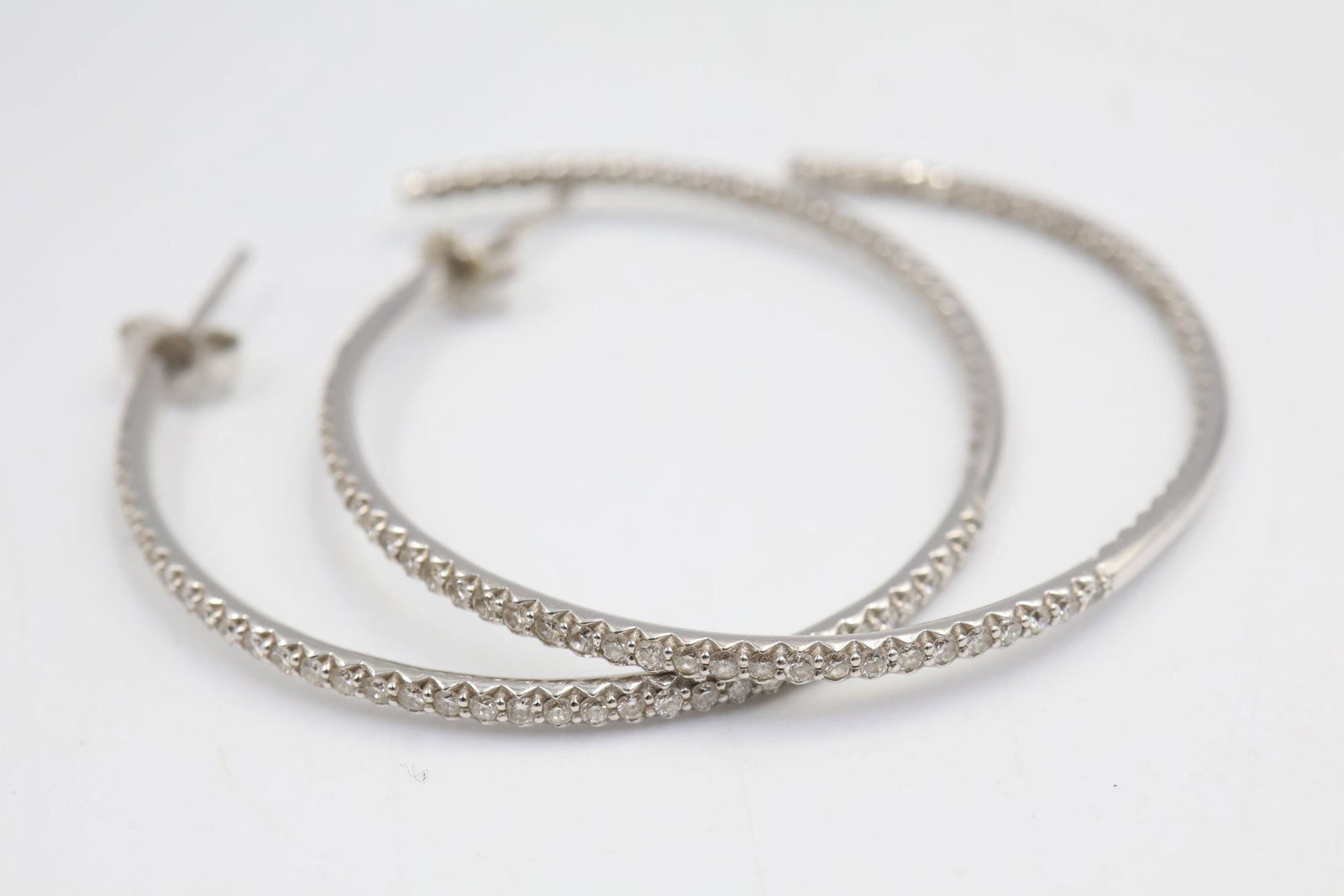 Roberto Coin 18k Gold & Diamond hoops: Roberto Coin 18K gold hoop earrings set with sparkling diamonds of approximately G–H colour and SI1–SI2 clarity. Total weight: 8.5 grams.