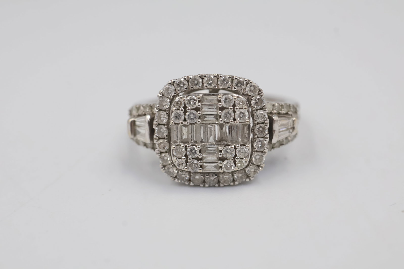 14k White Gold & Diamond Ring: 14K white gold ring set with 58 diamonds totaling approximately 1.00 carat, graded H colour, I1–I2 clarity. Ring size: 7. Total weight: 3.5 grams. Appraisal included.
