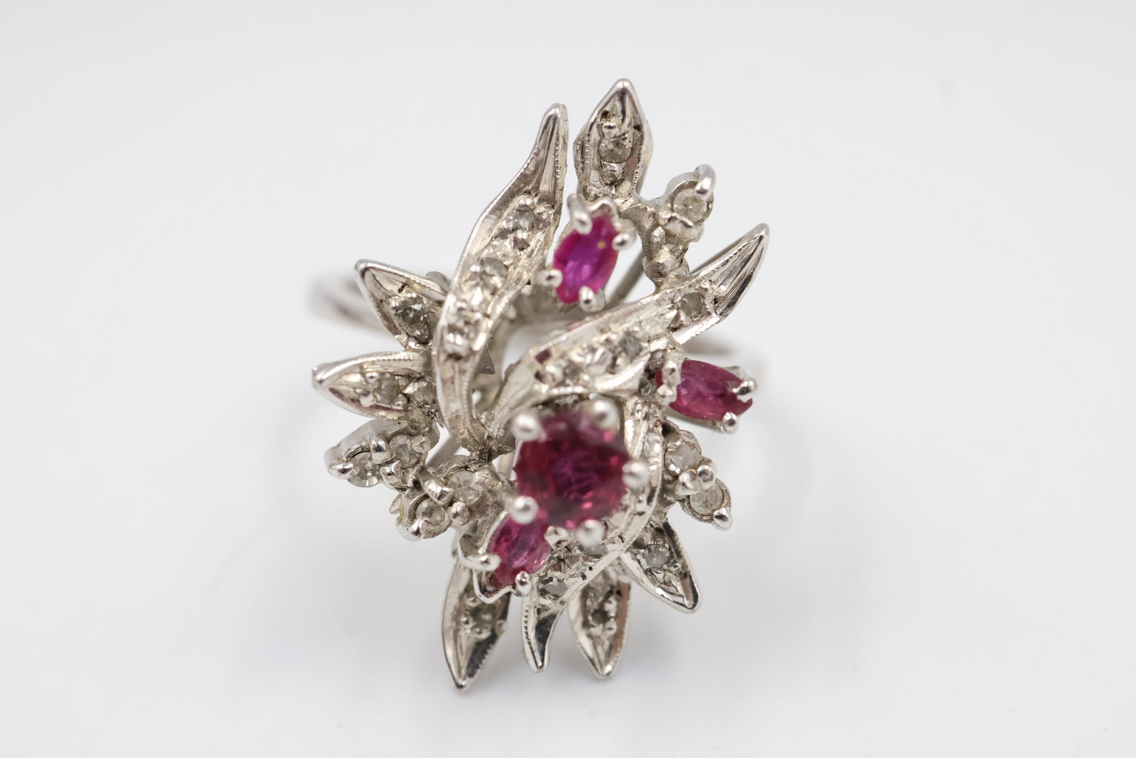 14k Diamond and Pink Sapphire Ring: 14K gold ring featuring vibrant pink sapphires accented by sparkling diamonds. A sophisticated fine jewellery piece combining vivid colour with classic brilliance.