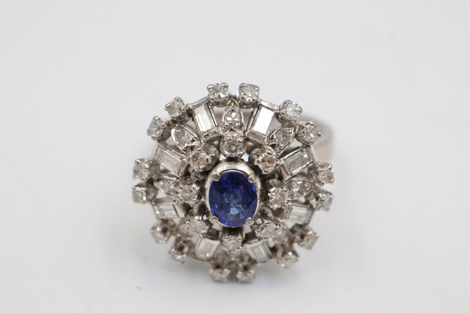 14K White Gold, Sapphire & Diamond Ring: Elegant 14k white gold ring featuring a sapphire accented by sparkling diamonds. Ring size: 6.5. Total weight: 6.71 grams.