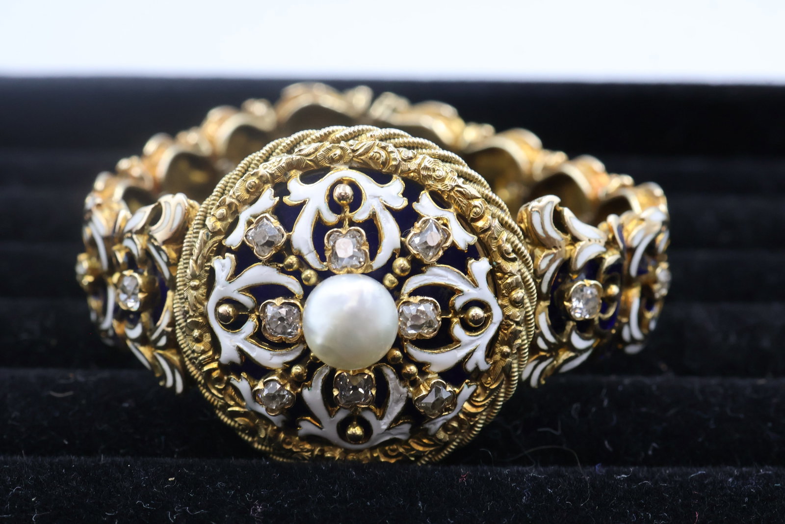 14k Gold, Diamond, Pearl & Enamel Bracelet: Elegant 14K gold bracelet accented with sparkling diamonds, lustrous pearls and enamel detailing. A distinctive fine jewellery piece combining rich texture, colour and timeless sophistication. Fits a 