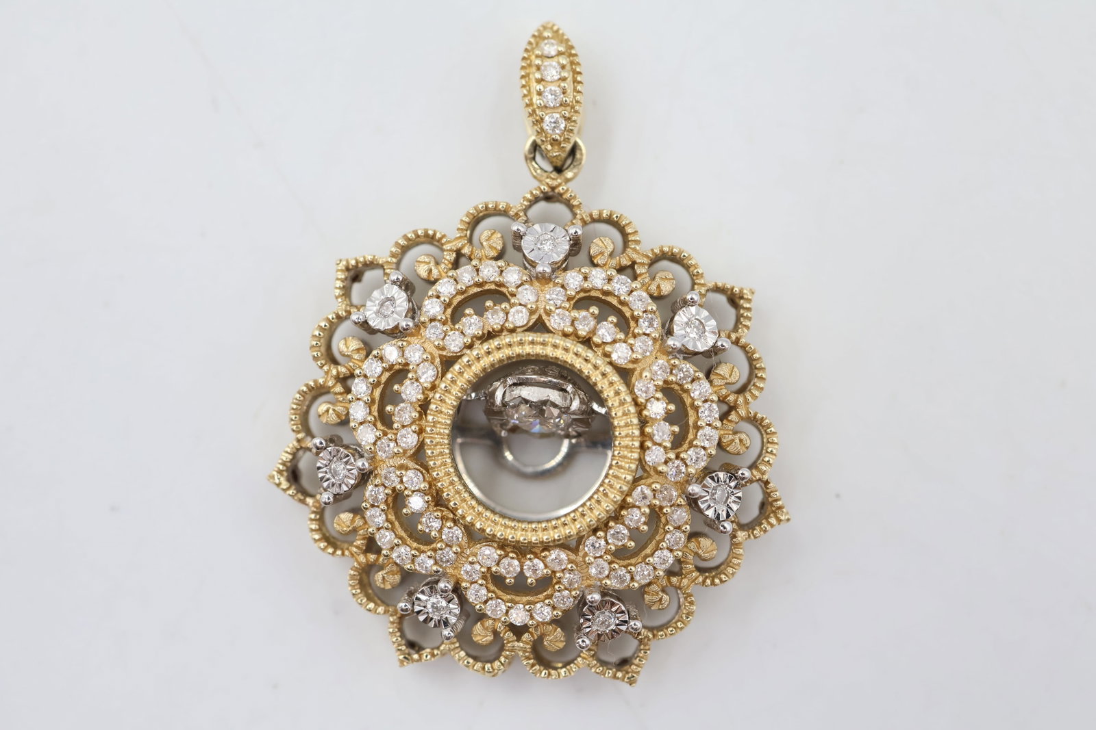 10k Gold & Diamond Pendant: 14K gold pendant accented with sparkling diamonds. A timeless and versatile fine jewellery piece offering classic brilliance and refined elegance. Weight 3.7 grams.