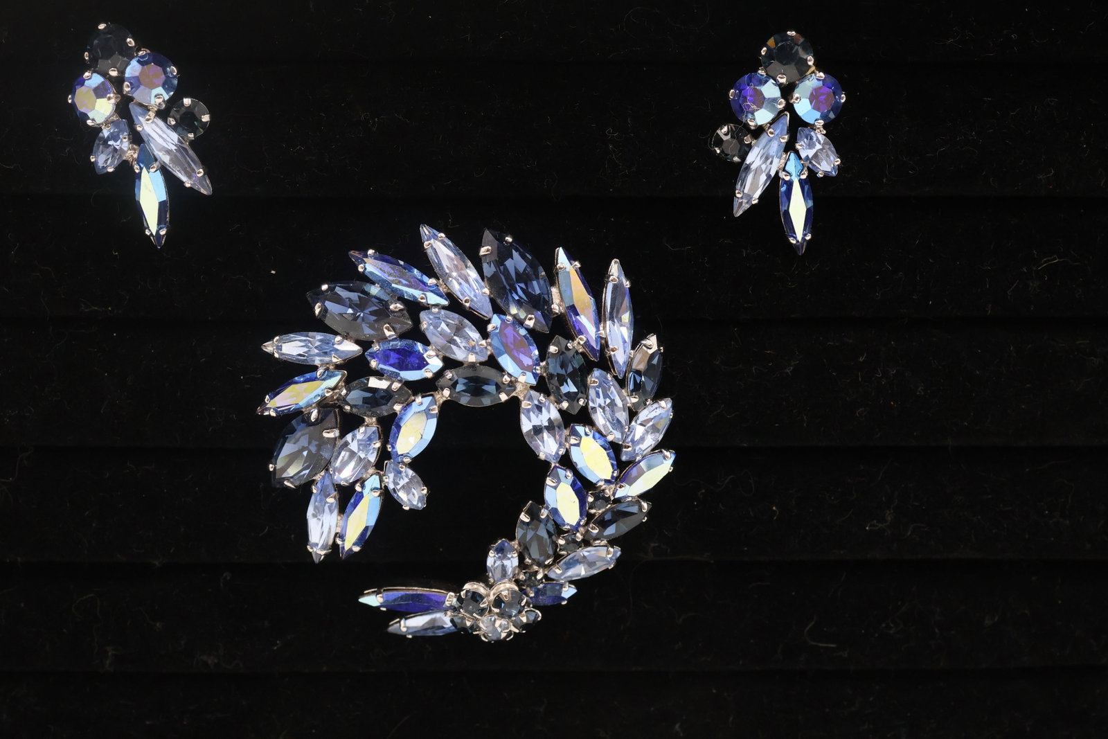 Sherman Shades Of Blue Brooch with Clip On Earrings: Sherman set comprising a brooch and coordinating clip-on earrings, adorned with brilliant blue crystals. A striking and collectible example of Sherman’s renowned Canadian costume jewellery.