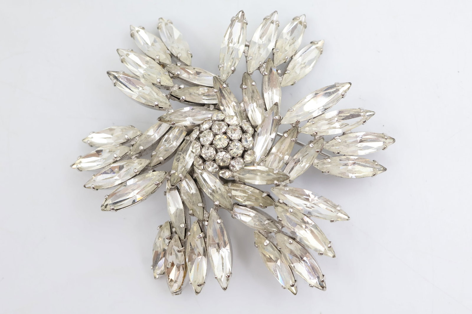 Sherman Clear Crystal Floral Brooch: Vintage Sherman brooch featuring sparkling clear crystals arranged in a graceful floral design. A timeless and collectible example of Sherman’s renowned Canadian costume jewellery.