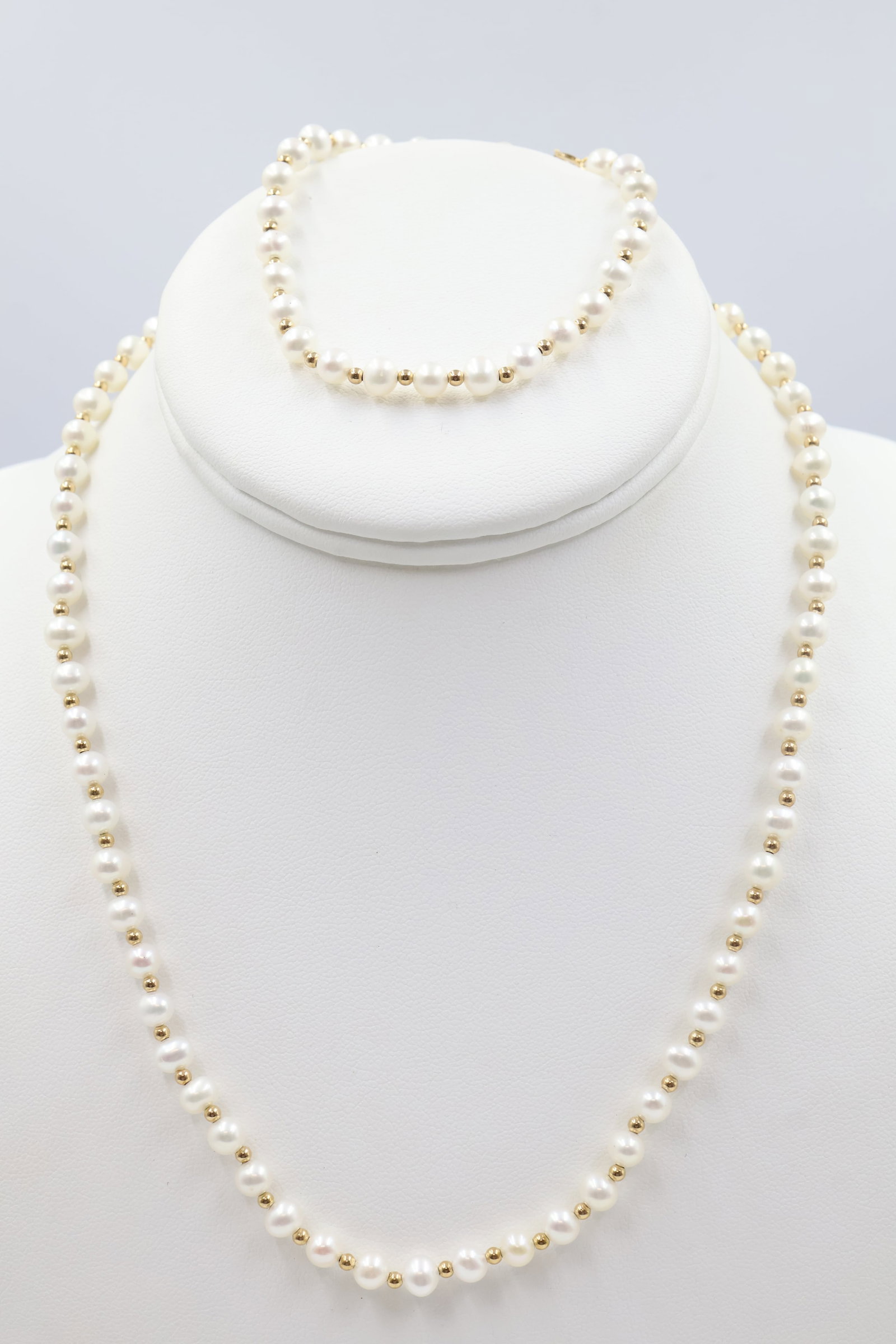 Pearl Bracelet & Necklace With 14k Beads & clasp: Matching pearl set accented with 14K gold beads and clasps. Necklace measures approximately 16 inches; bracelet fits approximately a 7-inch wrist. Total weight: 19.6 grams.