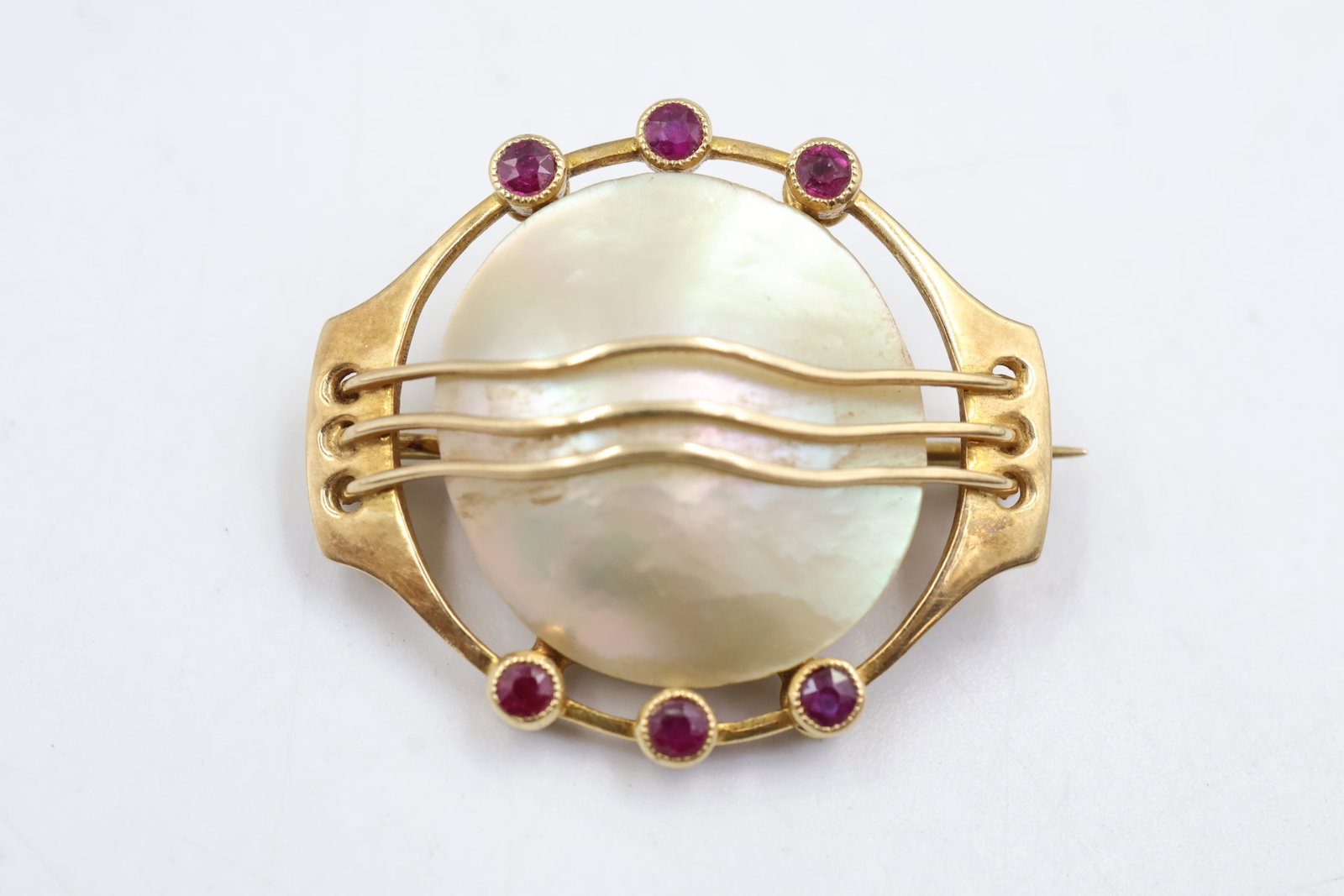 15k Gold, Opal & Stone Brooch: 15K gold brooch featuring a luminous opal accented with gemstones. A distinctive antique-inspired piece showcasing beautiful colour and timeless craftsmanship. Weight 6.38 grams.