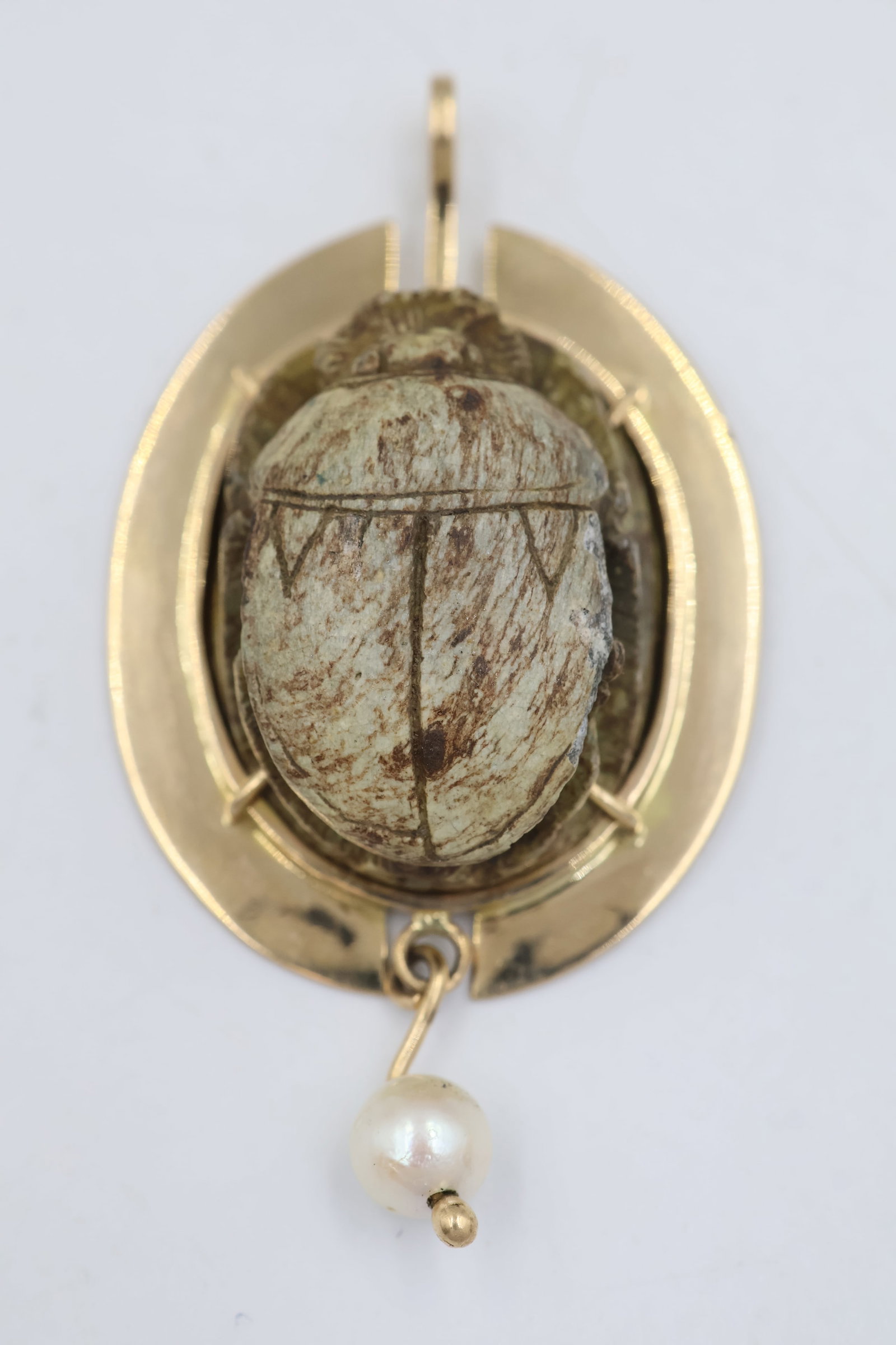 14K Carved Scarab Beetle Pendant: Distinctive 14K gold pendant featuring an intricately carved stone scarab beetle motif. Total weight: 13.4 grams.