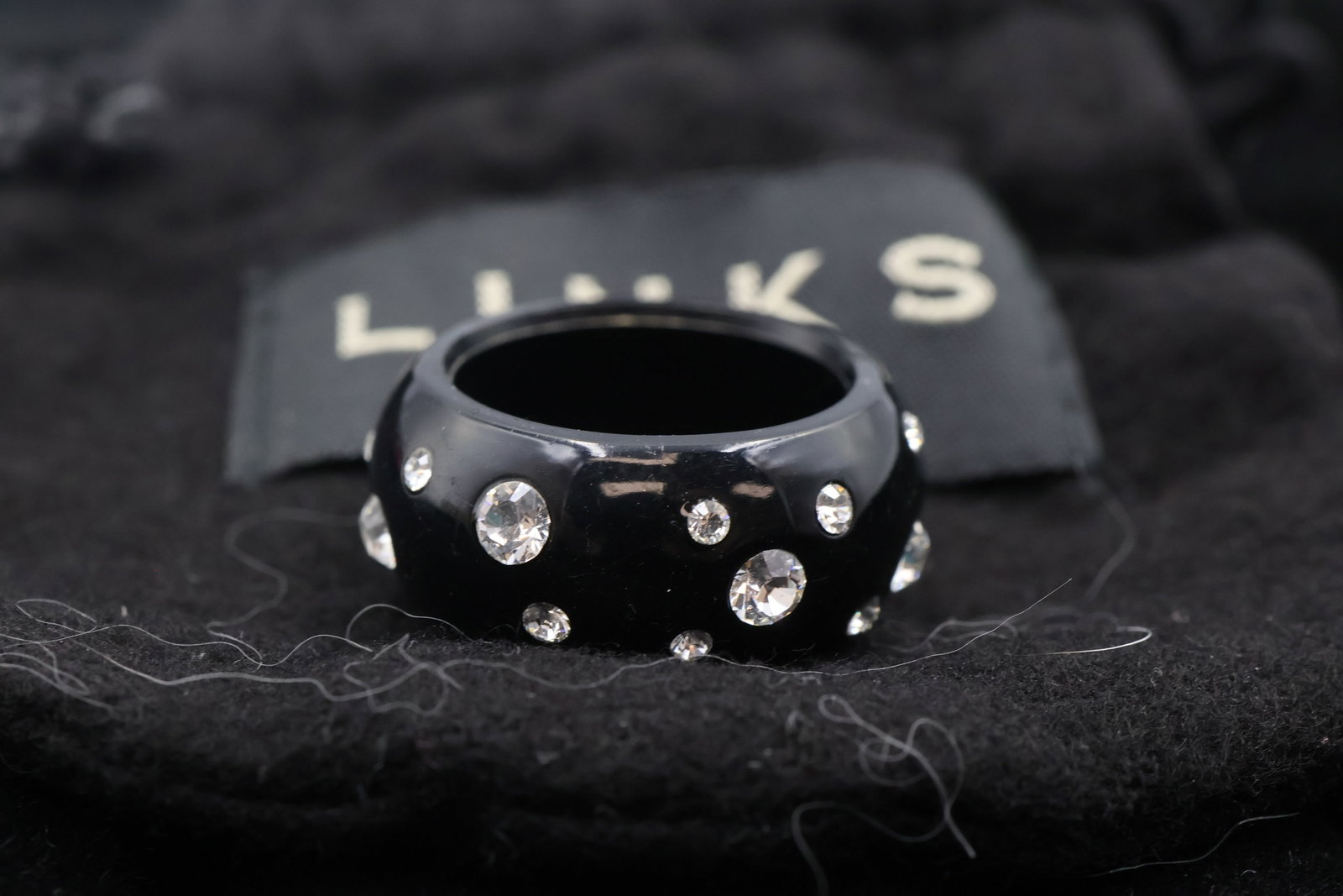 Links Of London Fashion Ring: Distinctive Links of London ring crafted in blackened sterling silver and accented with sparkling crystals. A bold contemporary design with sophisticated modern appeal.