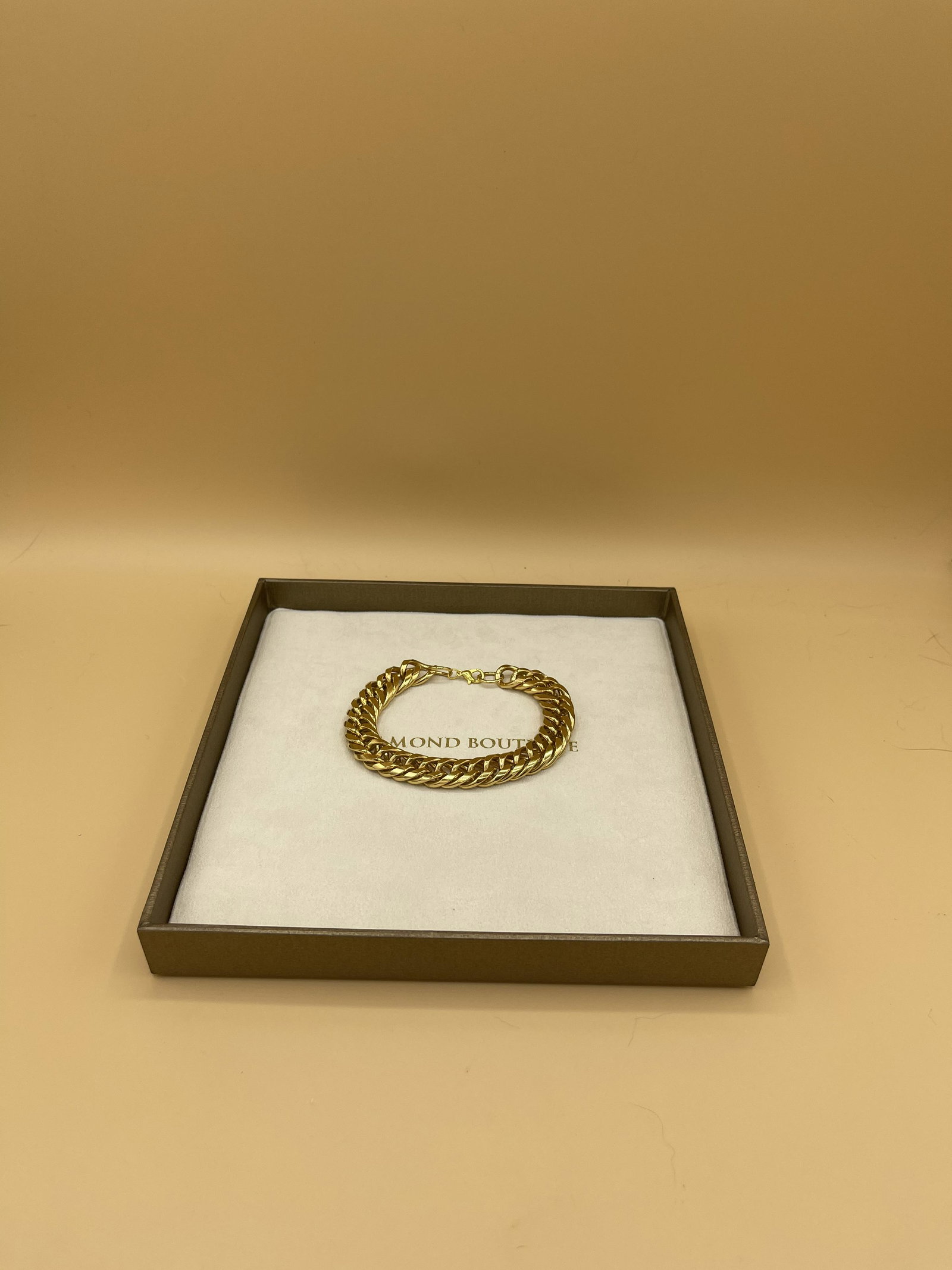 Antique Gold Cuban Link Mens Bracelet: Antique Mens yellow gold cuban link with diamond cut slits on each link. Comes with original box, both in mint condition