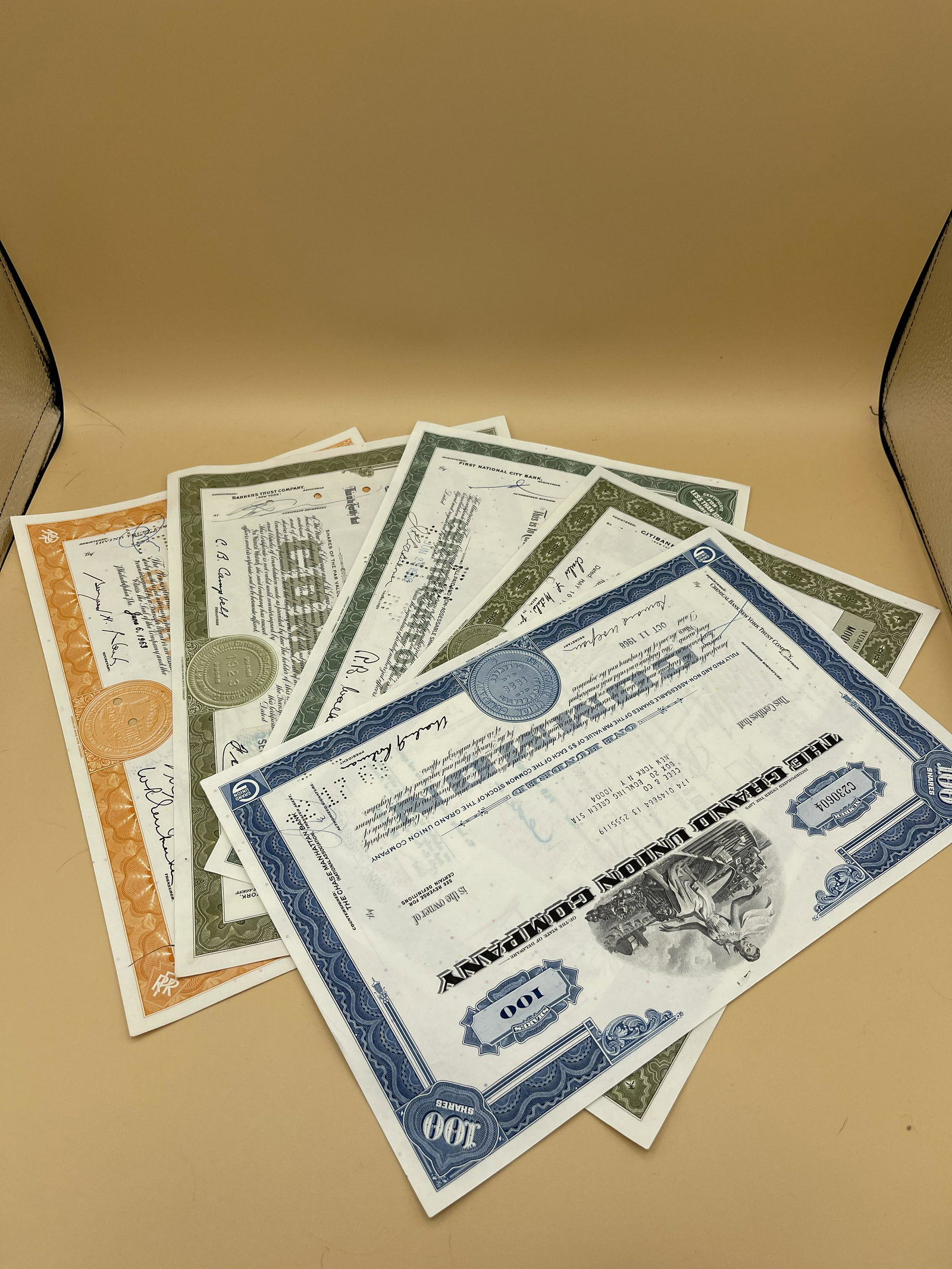 15 Total Collectible Paper Stocks & Bonds: An array of collectibles stocks and bonds with original photography of the Vanderbilts, companies such as ARCO, The Grand Union Railroad Company, Wells Fargo, and so many more!