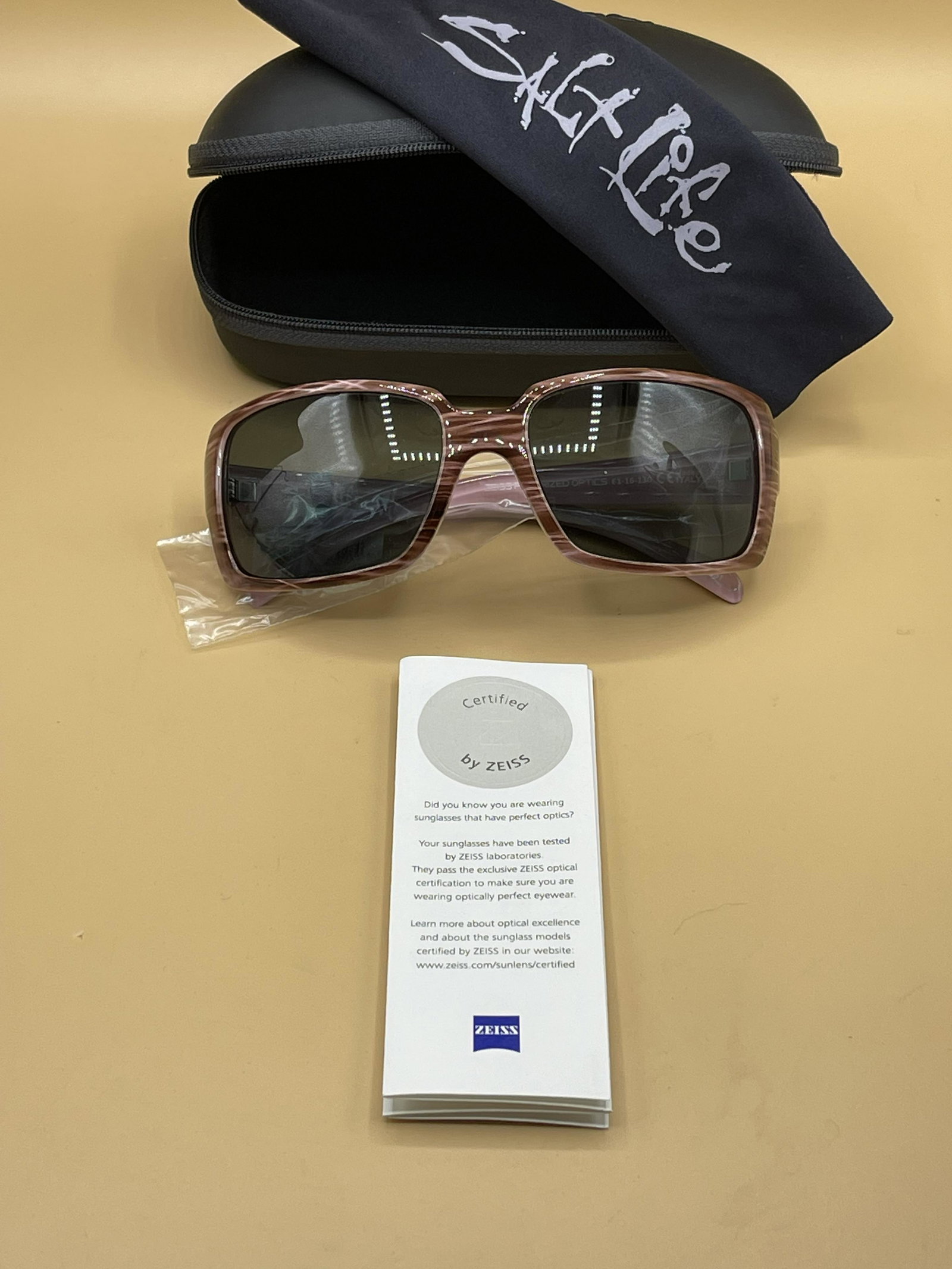 Designer Polarized Sangria Stripe Sunglasses: Designer Polarized Sangria Stripe Sunglasses, comes in original packaging, including: case, sunglasses, warranty card, and cloth still in plastic packaging